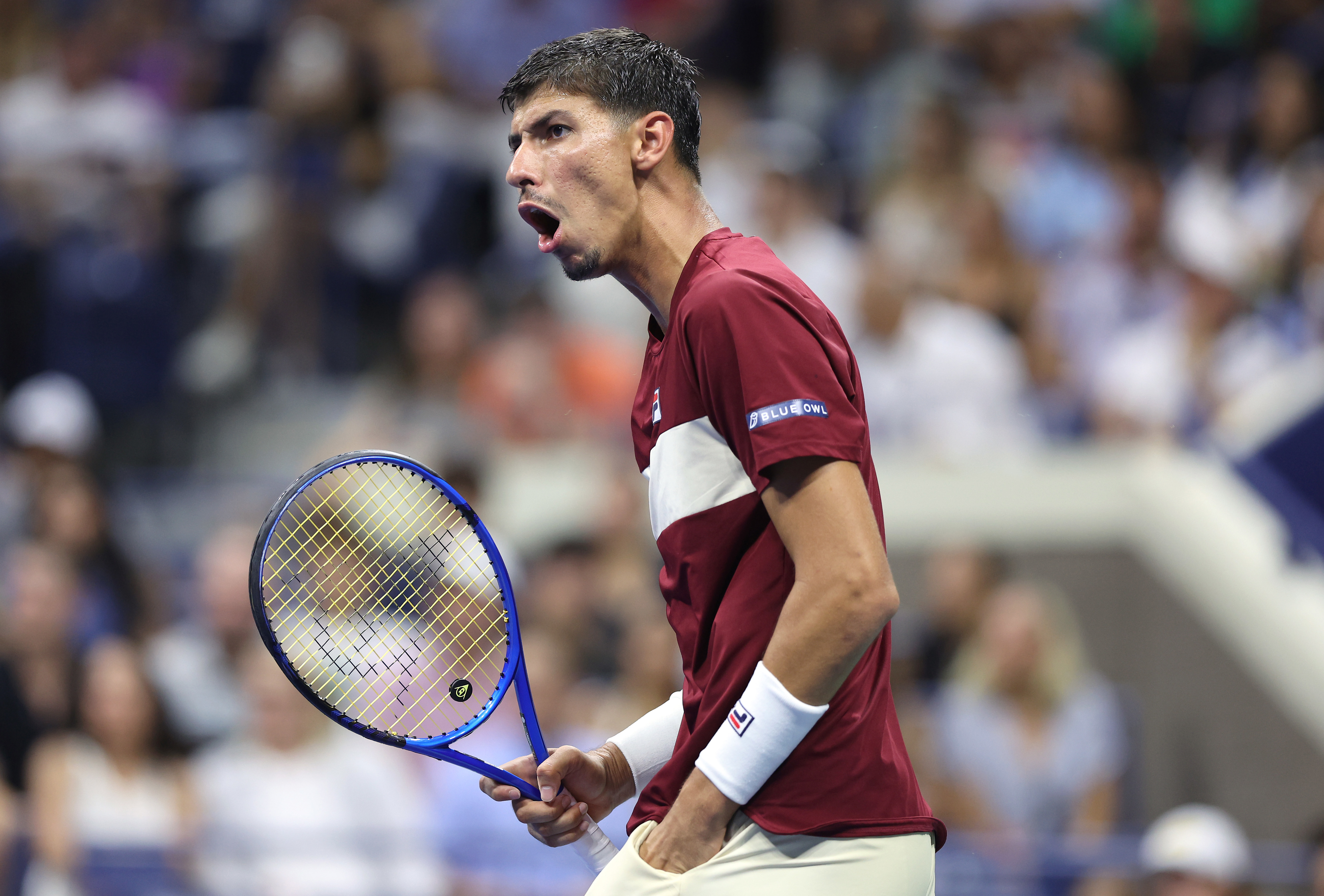 Alexei Popyrin of Australia reacts against Frances Tiafoe of the United States.