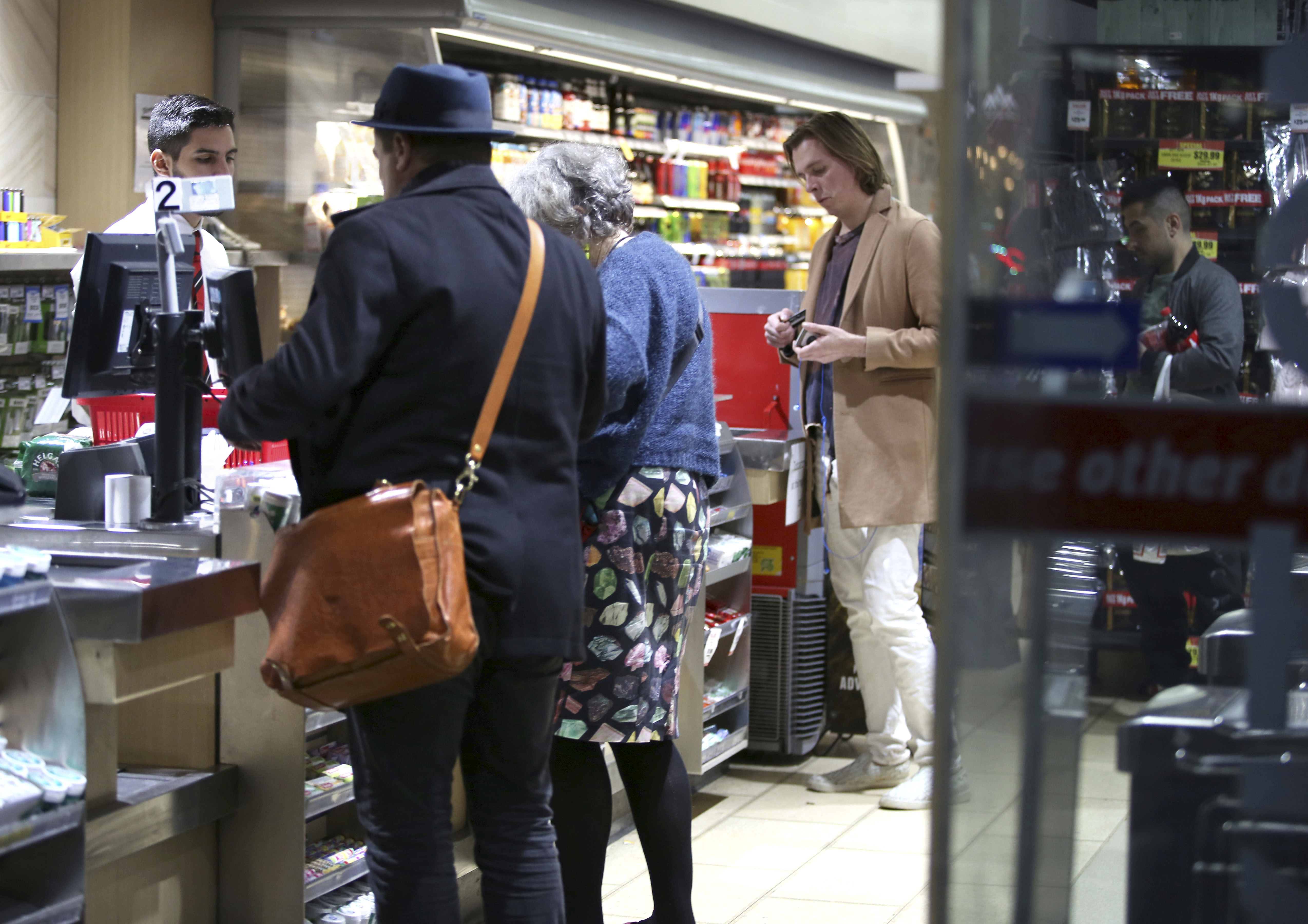 Shoppers at the checkout of a major grocery retailer.