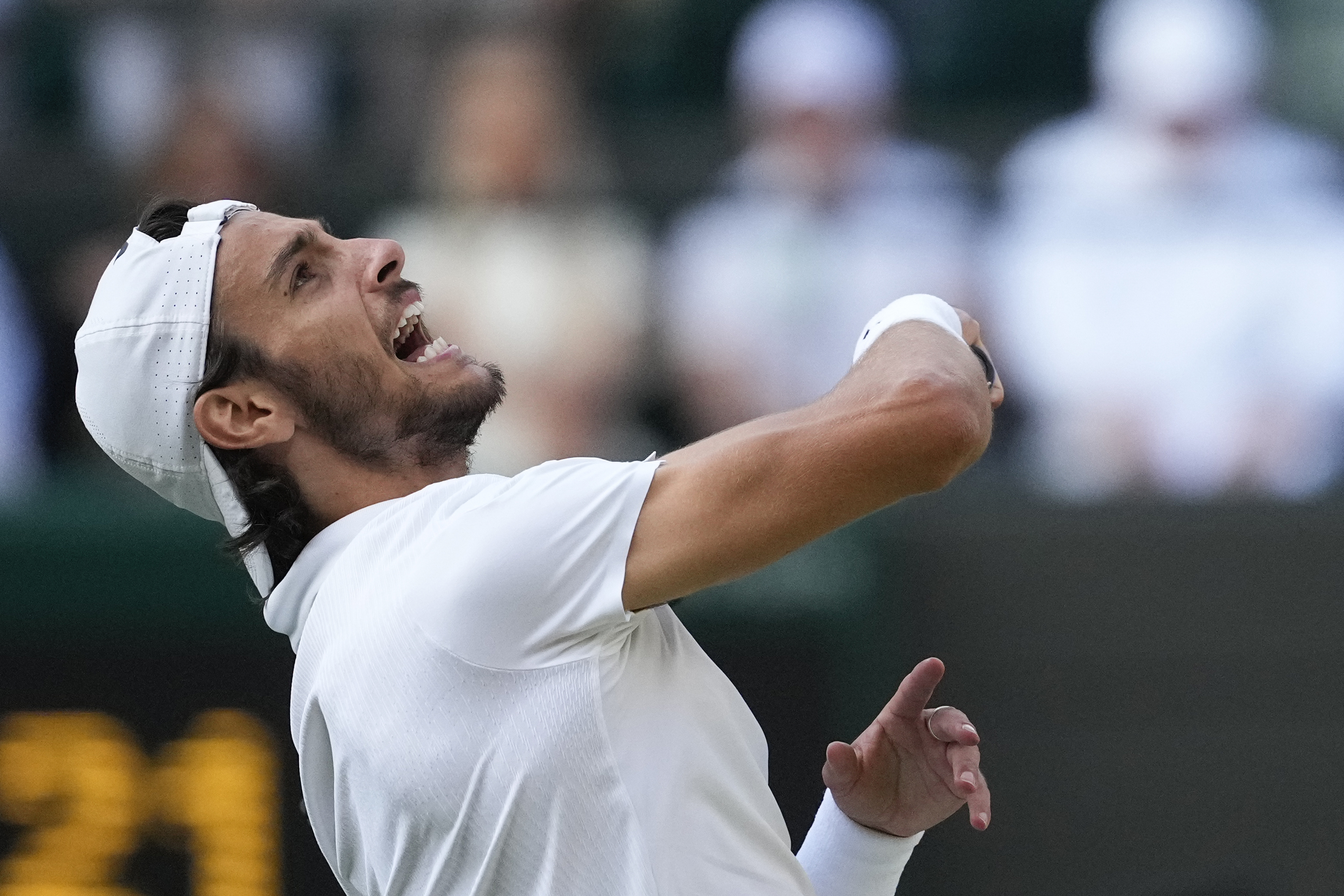 Lorenzo Musetti of Italy celebrates after defeating Taylor Fritz of the United States.