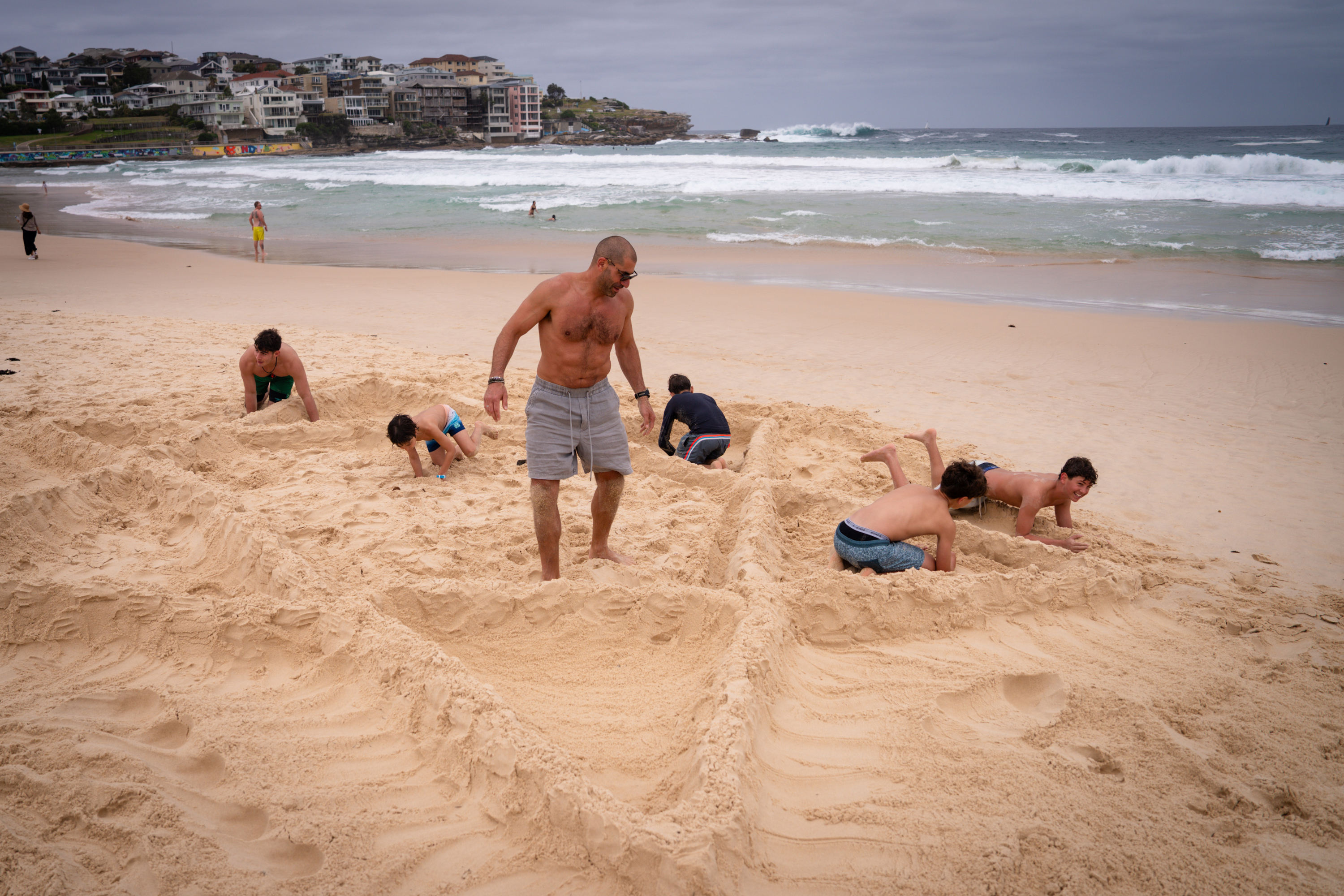 Two families build a Star of David at Bondi Beach, two days after a mass shooting, on December 16, 2025 in Sydney, Australia.