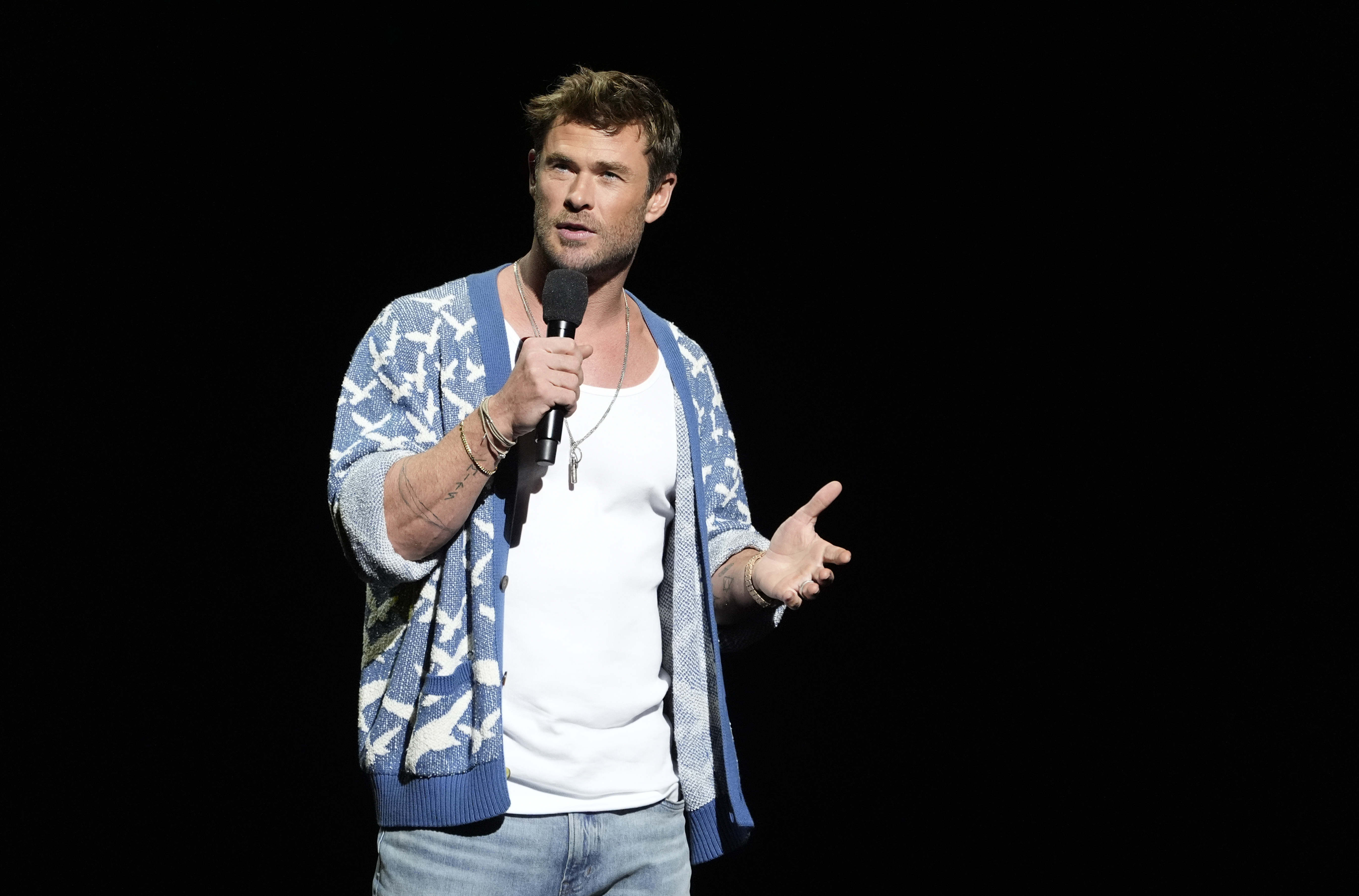 Chris Hemsworth, a cast member in the upcoming film "Transformers One," discusses the film during the Paramount Pictures presentation at CinemaCon 2024, Thursday, April 11, 2024, at Caesars Palace in Las Vegas. (AP Photo/Chris Pizzello)