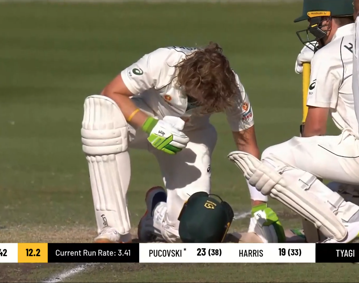 Will Pucovski recovers from the blow.