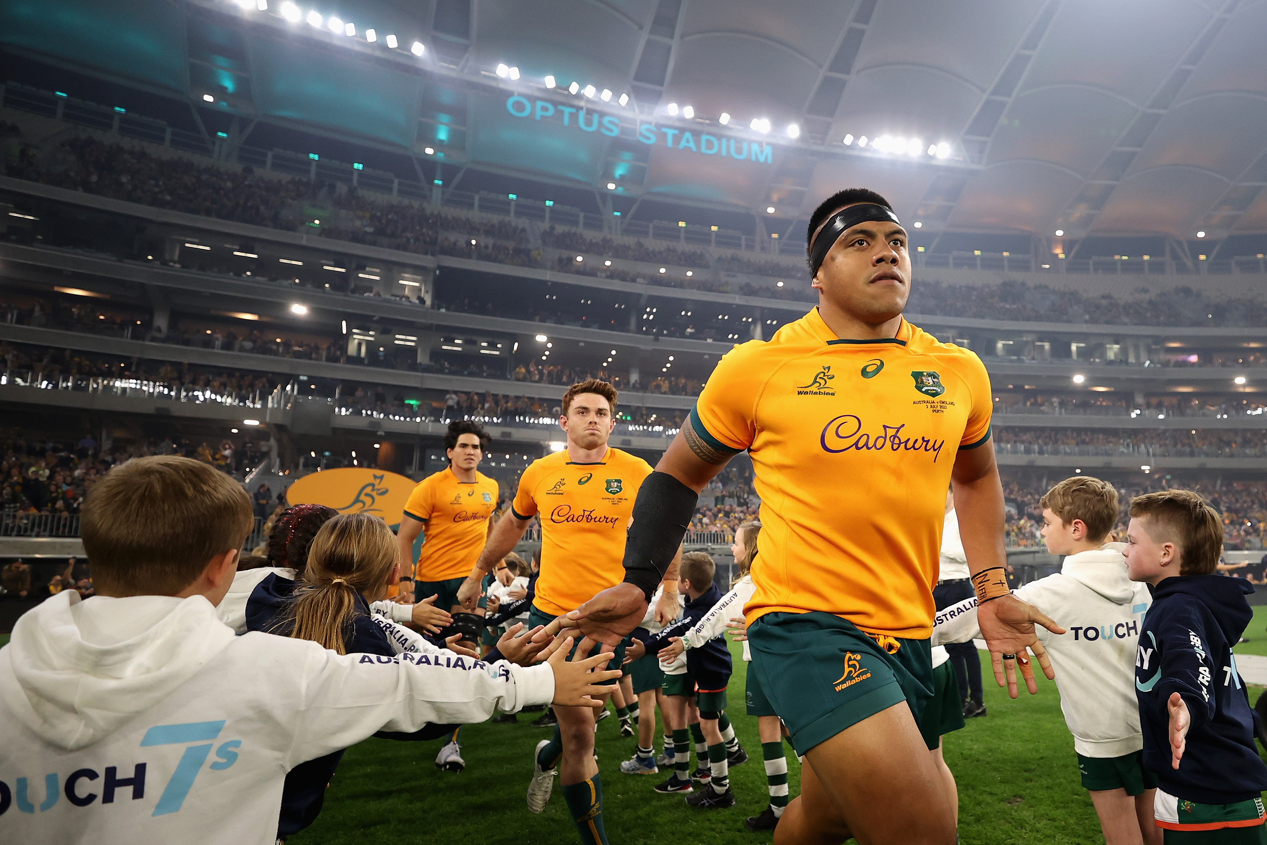 Allan Alaalatoa of the Wallabies runs onto the field.