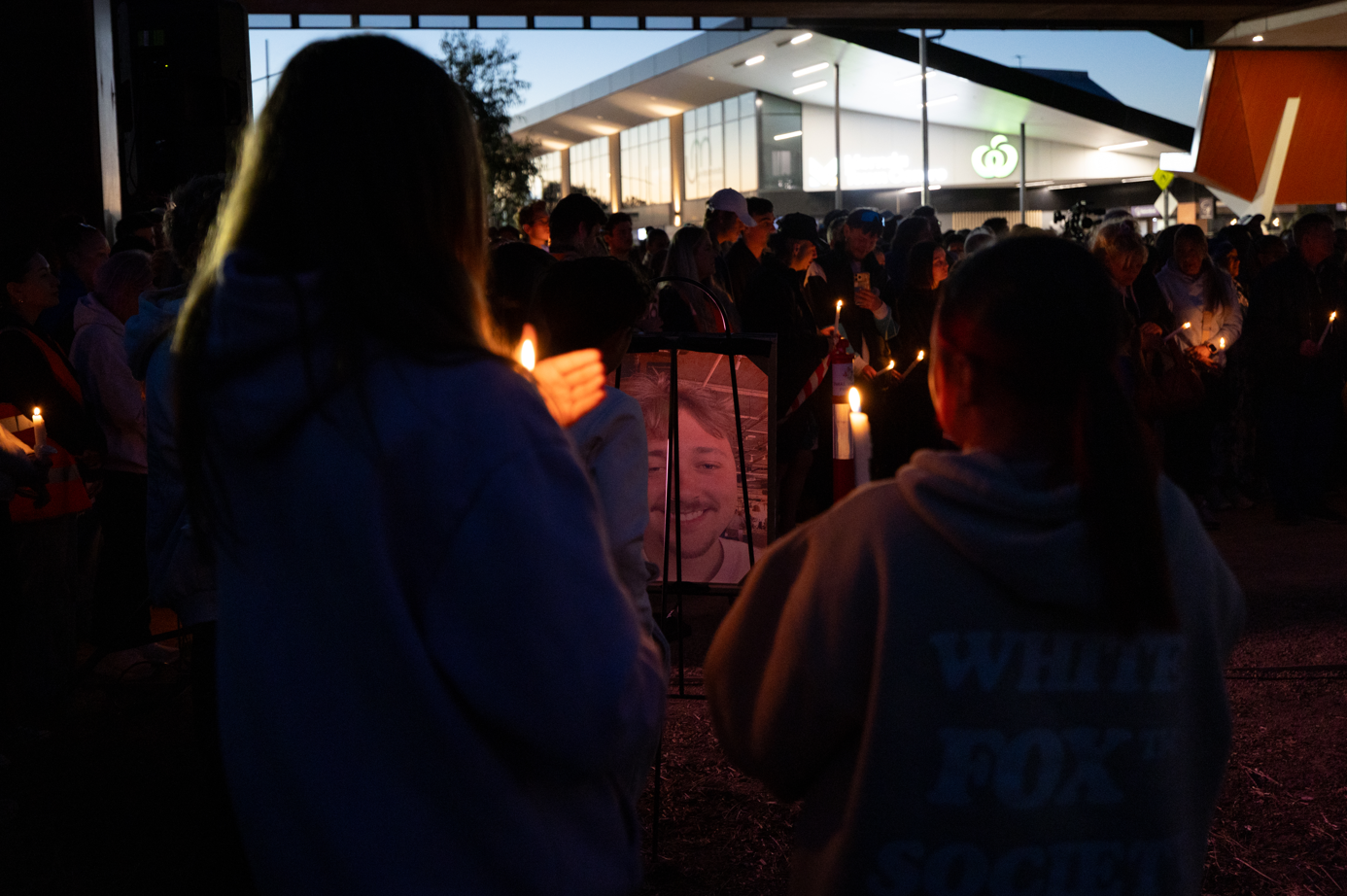 Thousands of people stood in silence at a vigil last night to honour 22-year-old Aidan Becker.