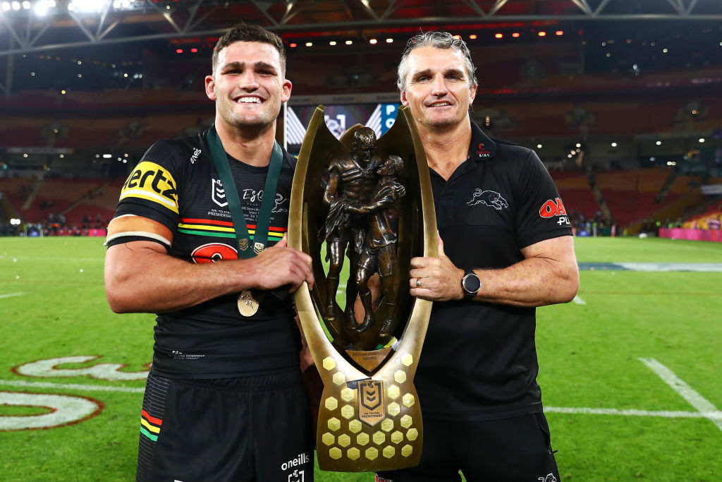 Nathan and Ivan Cleary holding the premiership trophy.