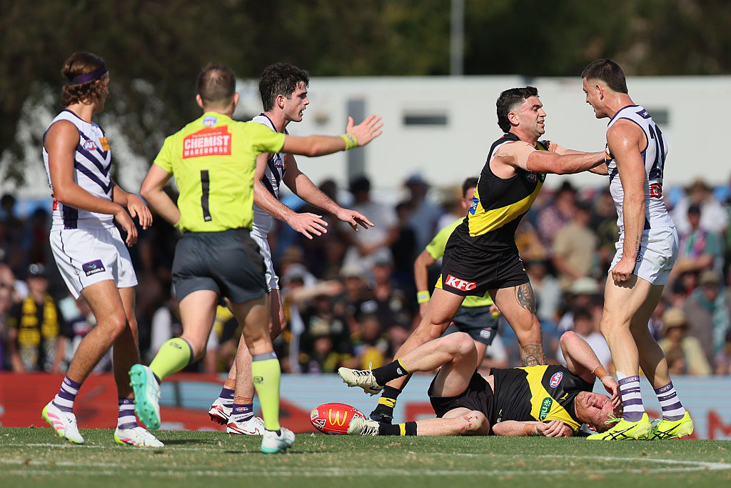 Nick Vlastuin of the Tigers is injured by Patrick Voss of the Dockers.