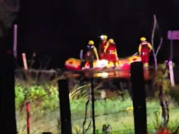 Three people have been rescued from floodwaters in Queensland as heavy rain sparked flood warnings across large parts of the state.