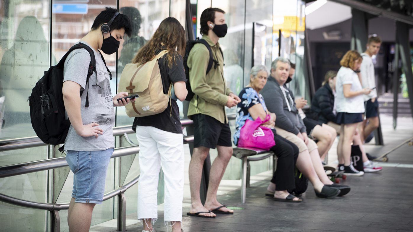 People with and without out Masks due to COVID-19 at Bus stops in George Street, Sydney.  12th October 2020.