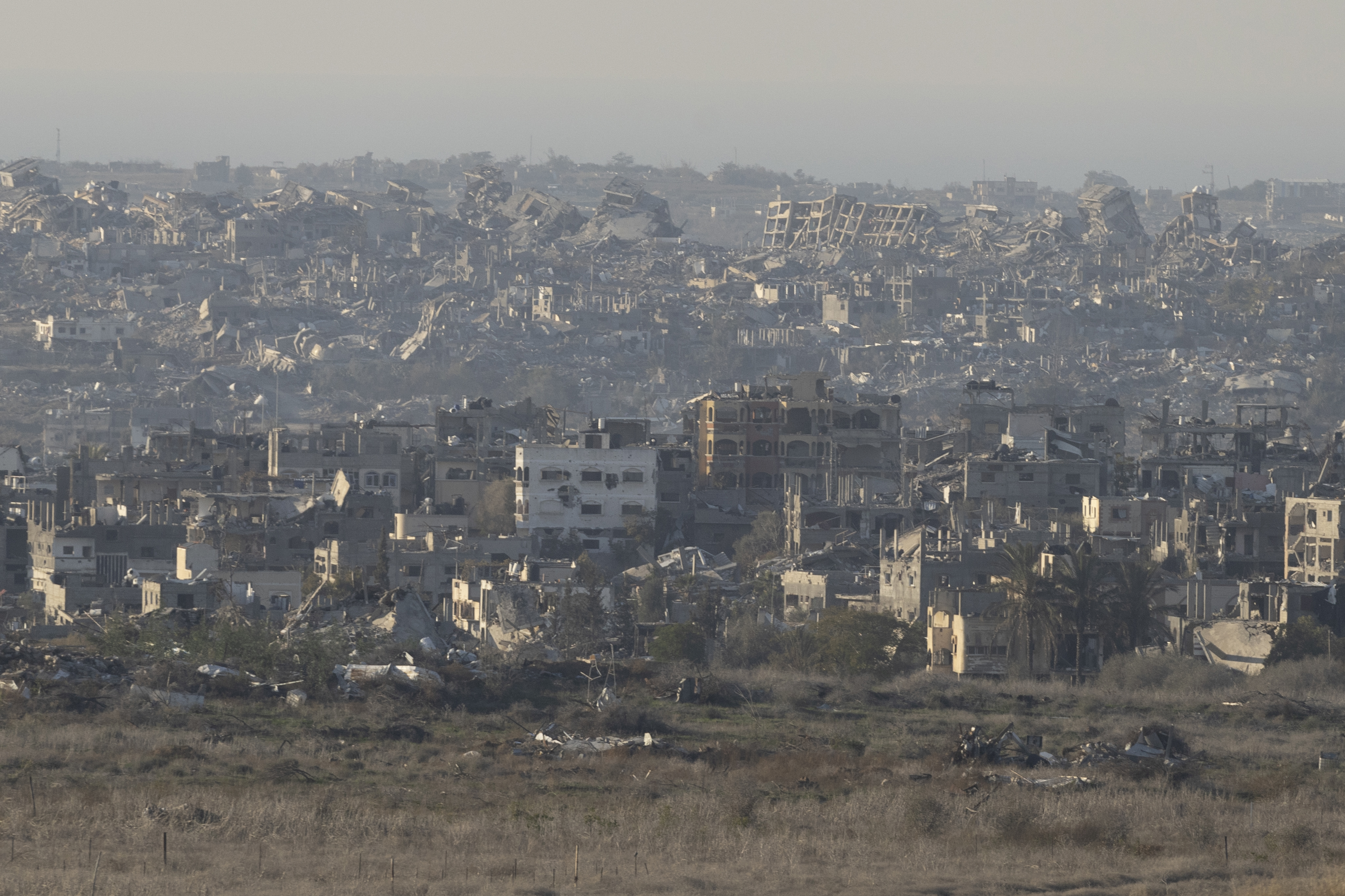 SOUTHERN ISRAEL, ISRAEL - JANUARY 13: A view over the northern Gaza Strip as seen from a position on the Israeli side of the border on January 13, 2025 in Southern Israel, Israel. This morning saw a fresh round of media reports about a phased ceasefire and hostage deal between Israel and Hamas being in its "final stages." (Photo by Amir Levy/Getty Images)