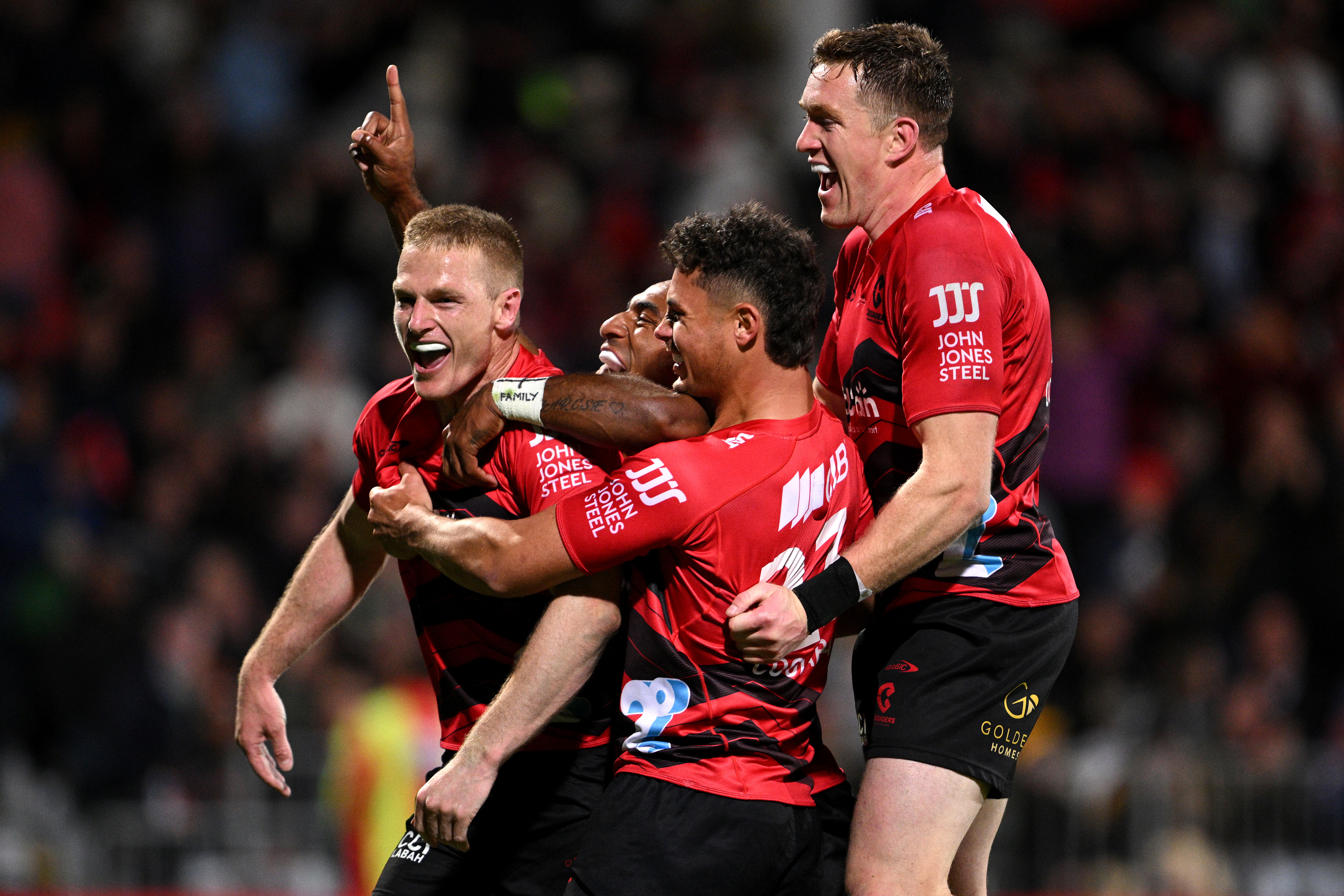 Johnny McNicholl of the Crusaders celebrates after scoring a try during the round six Super Rugby Pacific.