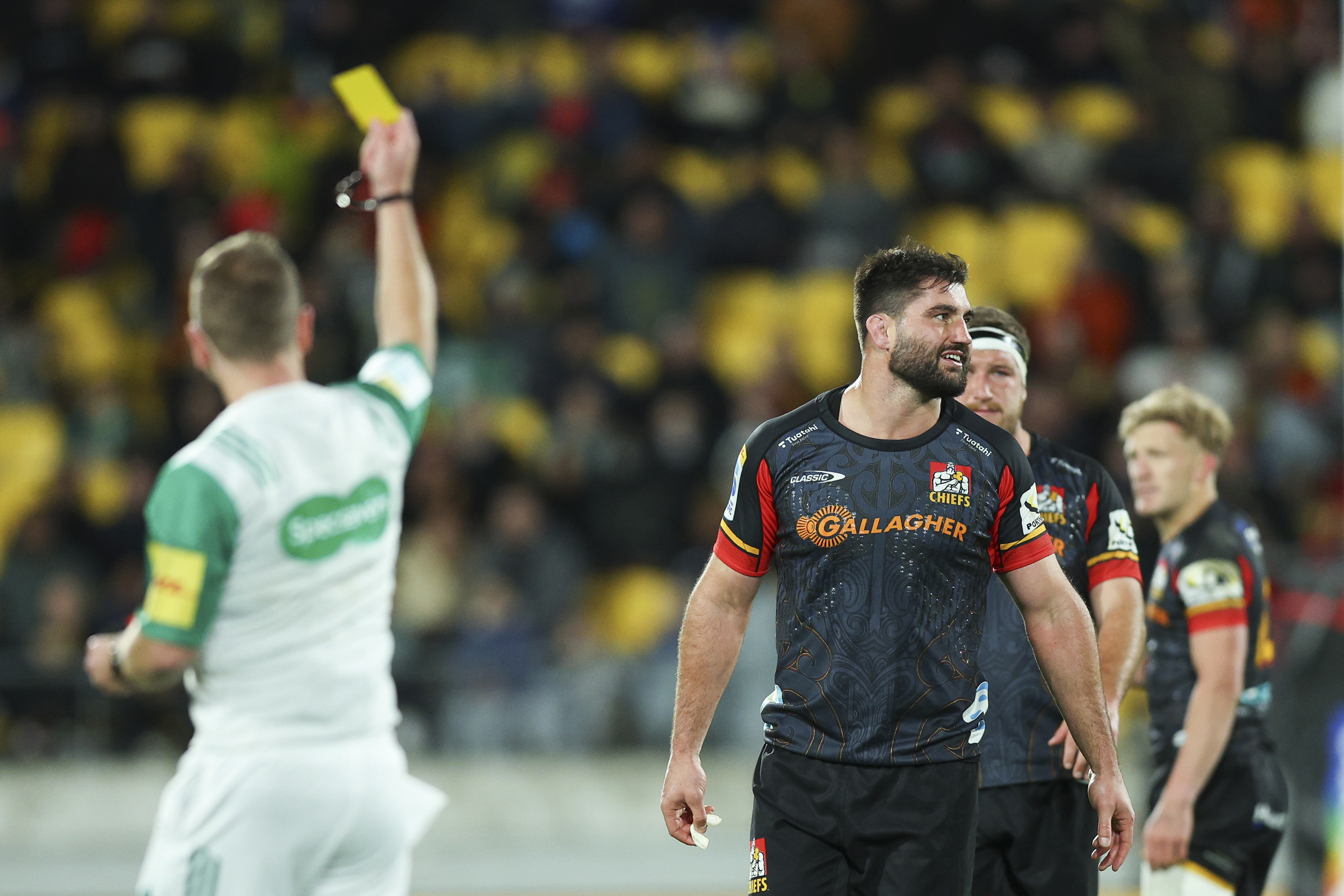 Referee Angus Gardner shows a yellow card to Luke Jacobson of the Chiefs during the Super Rugby Pacific semi-final match.