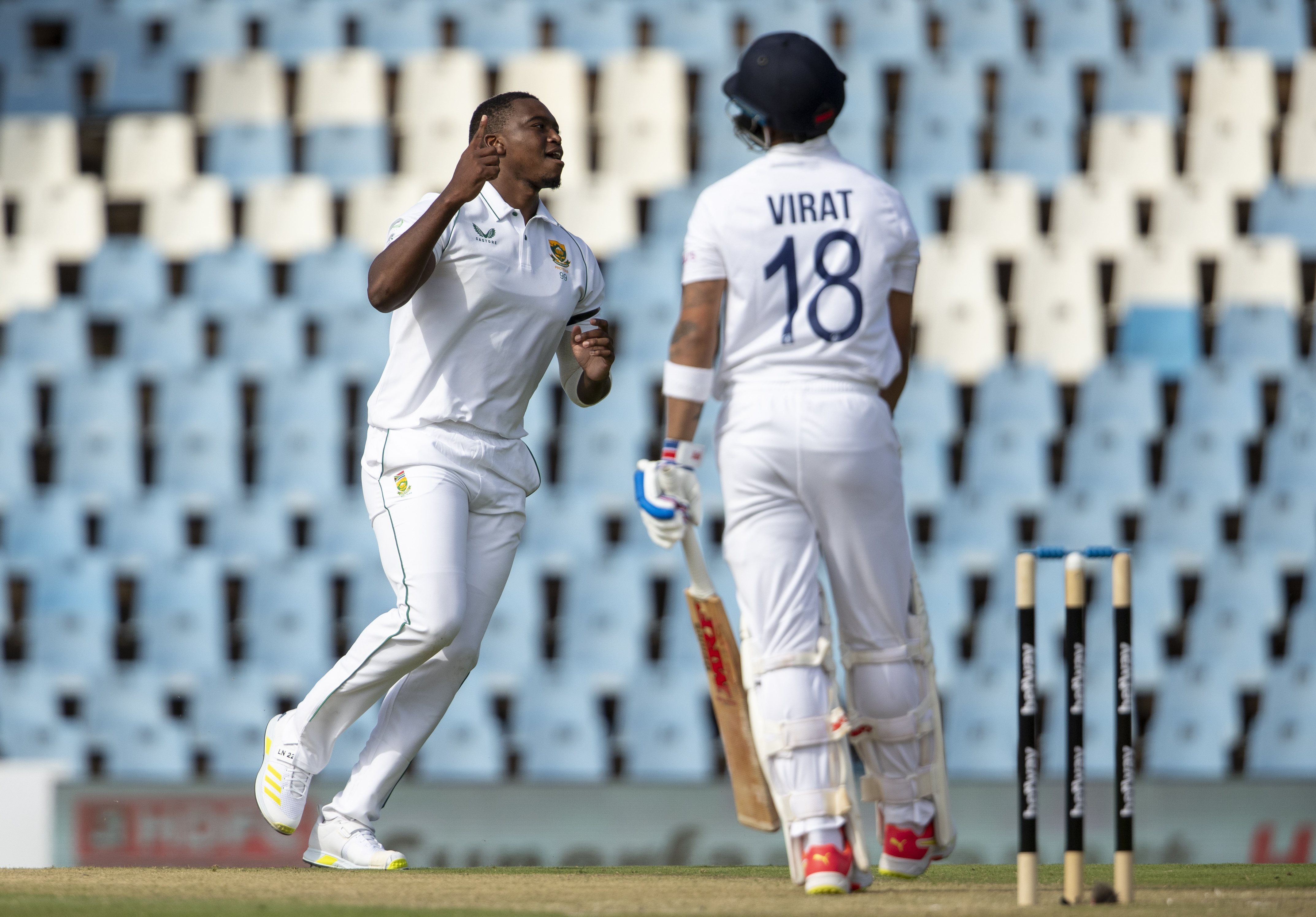 South Africa's Lungi Ngidi, left, celebrates after dismissing India's captain Virat Kohli during the Test Cricket match between South Africa India.