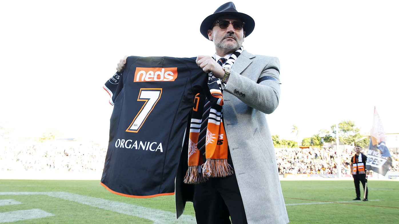 Wests Tigers Chairman Lee Hagipantelis holds up the number seven jersey as a tribute to the late Tommy Tommy Raudonikis during the round five NRL match between the Wests Tigers and the North Queensland Cowboys at Leichhardt Oval, on April 11, 2021, in Sydney, Australia. (Photo by Matt King/Getty Images)
