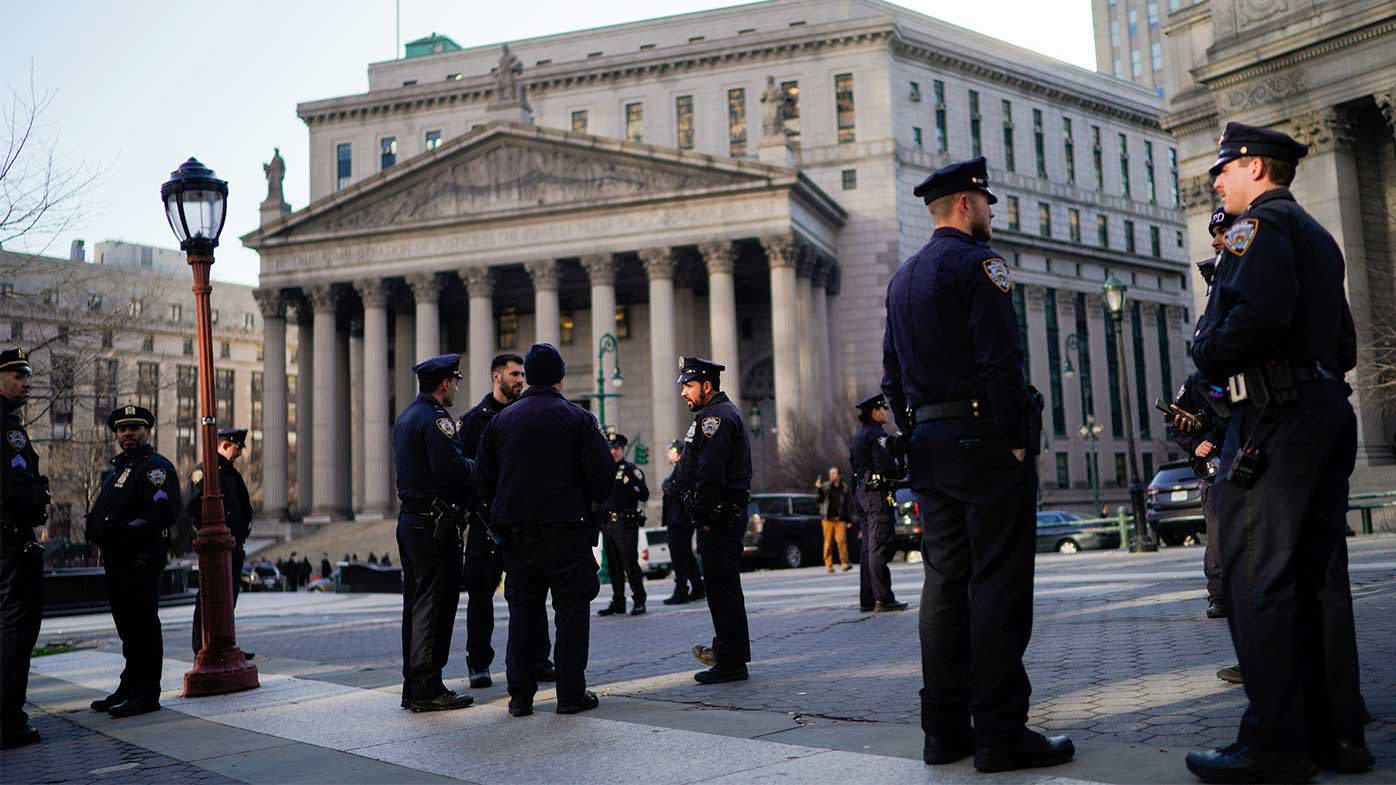 NYPD officers stand watch outside the Manhattan Criminal Courthouse ahead of potential protests.