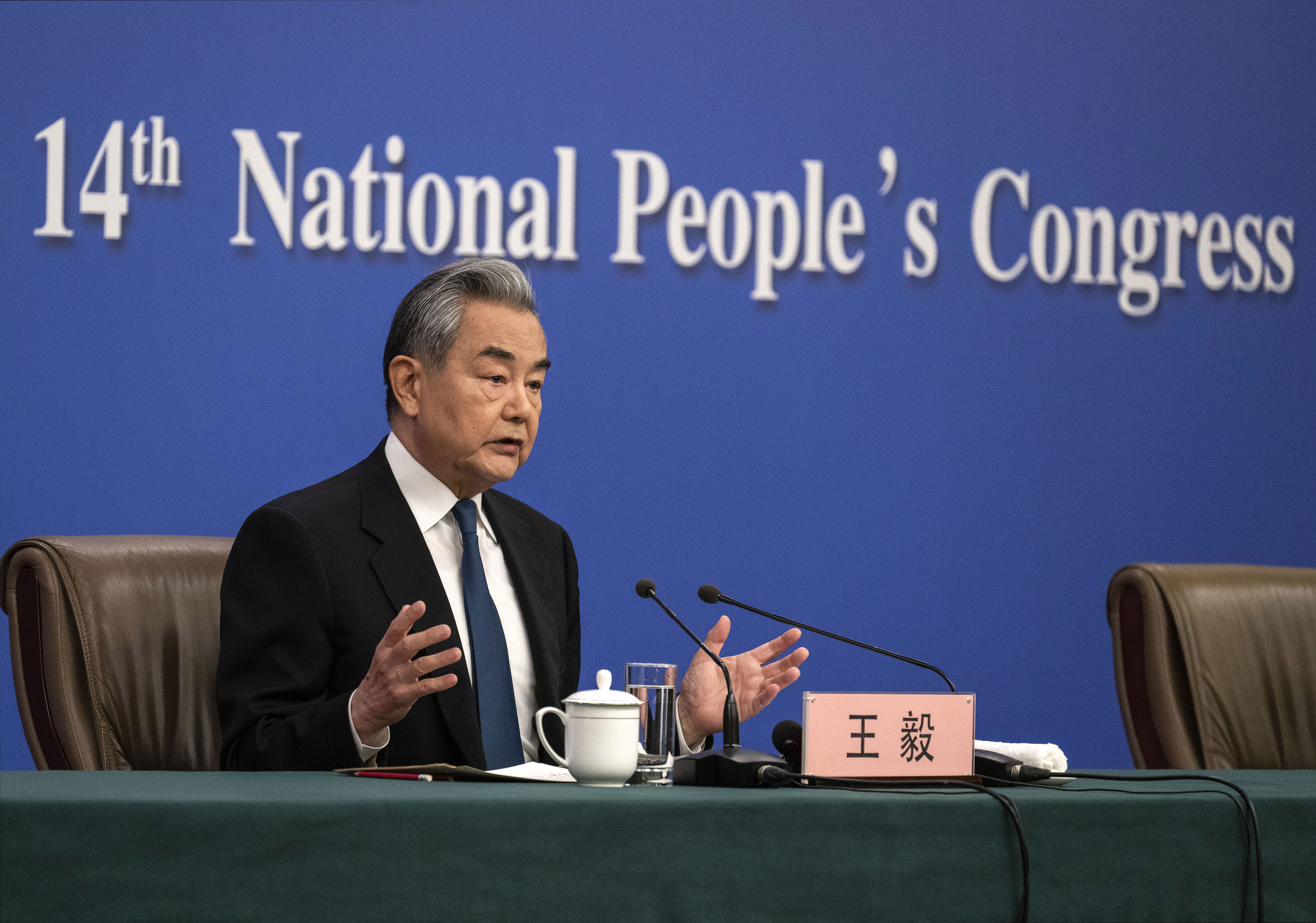BEIJING, CHINA - MARCH 8: Chinese Foreign Minister Wang Yi gestures as he answers a question at a press conference with foreign and domestic media as part of the National Peoples Congress on March 8, 2026 in Beijing, China. China's annual political gatherings, which includes the important National Peoples Congress (NPC), and is known as the Two Sessions, convenes leaders and lawmakers to set the government's agenda for domestic economic and social development for the year. The meetings are expec