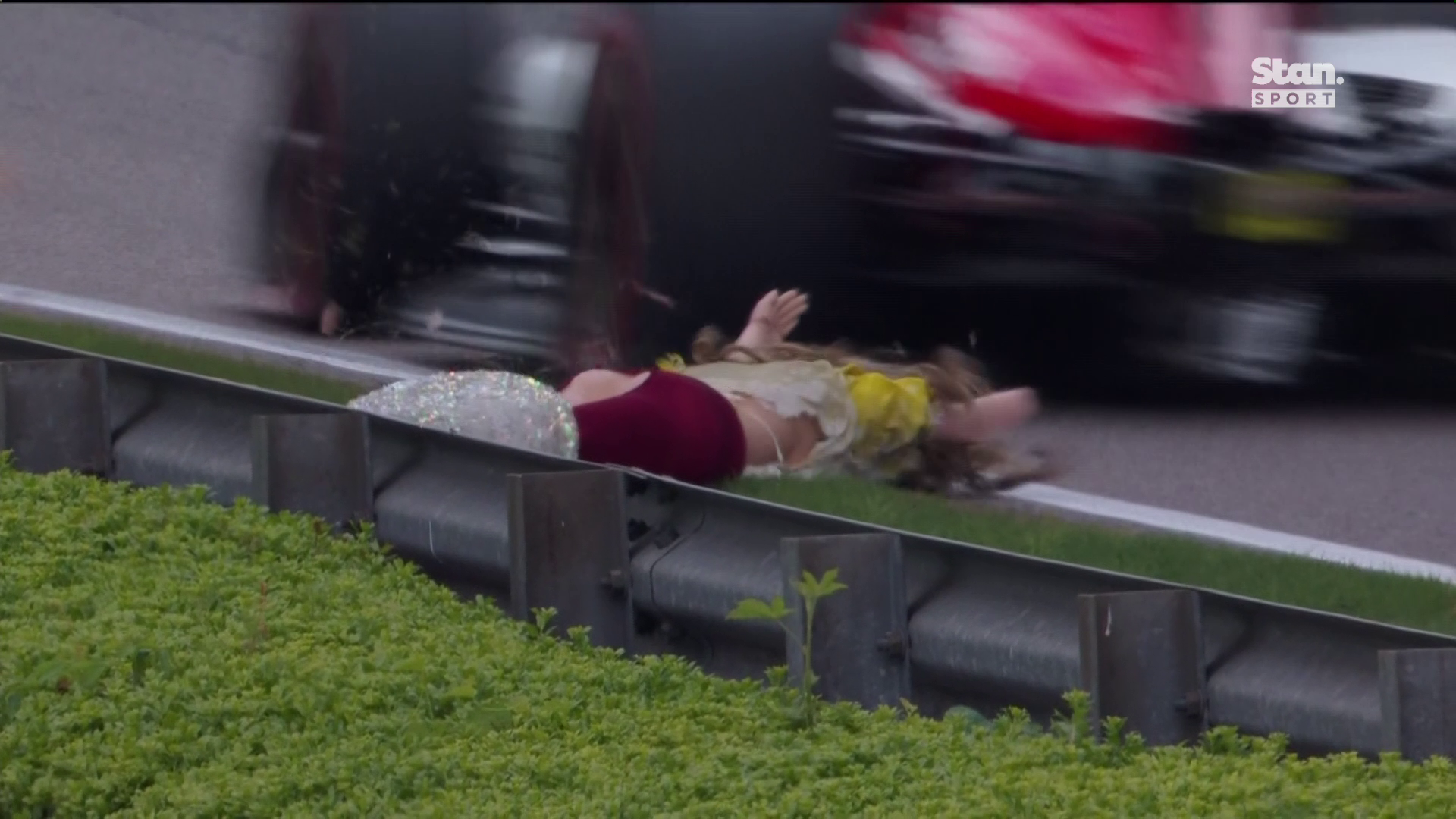 A mannequin hung from a bridge over Barber Motorsports Park fell before being hit in the IndyCar race.