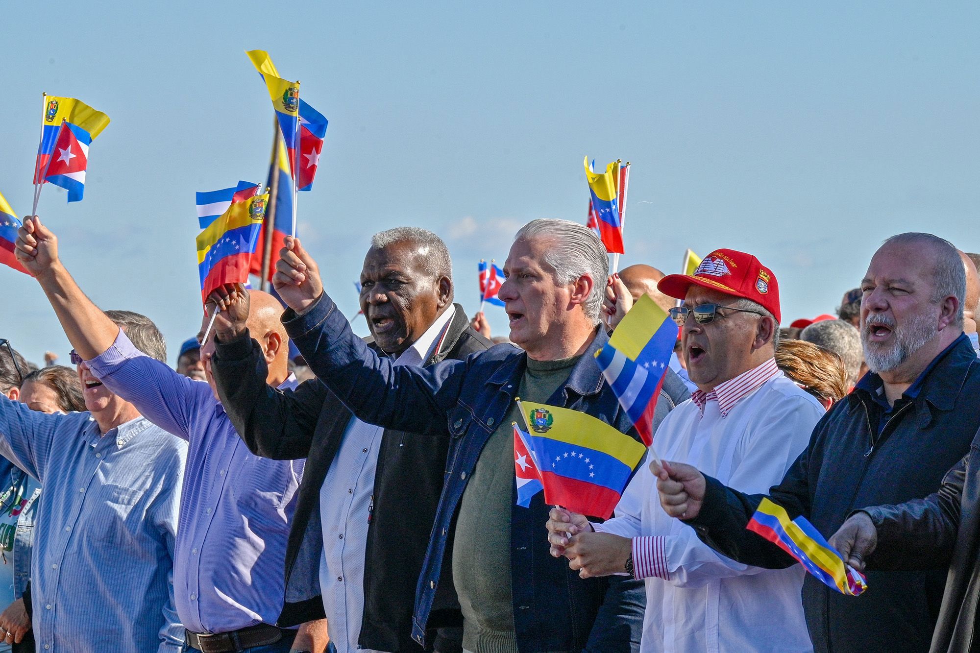 Cuba's President Miguel Diaz-Canel flutters a Venezuelan national flag in support of Venezuelan leader Nicolas Maduro in Havana on January 3 after US forces captured him.