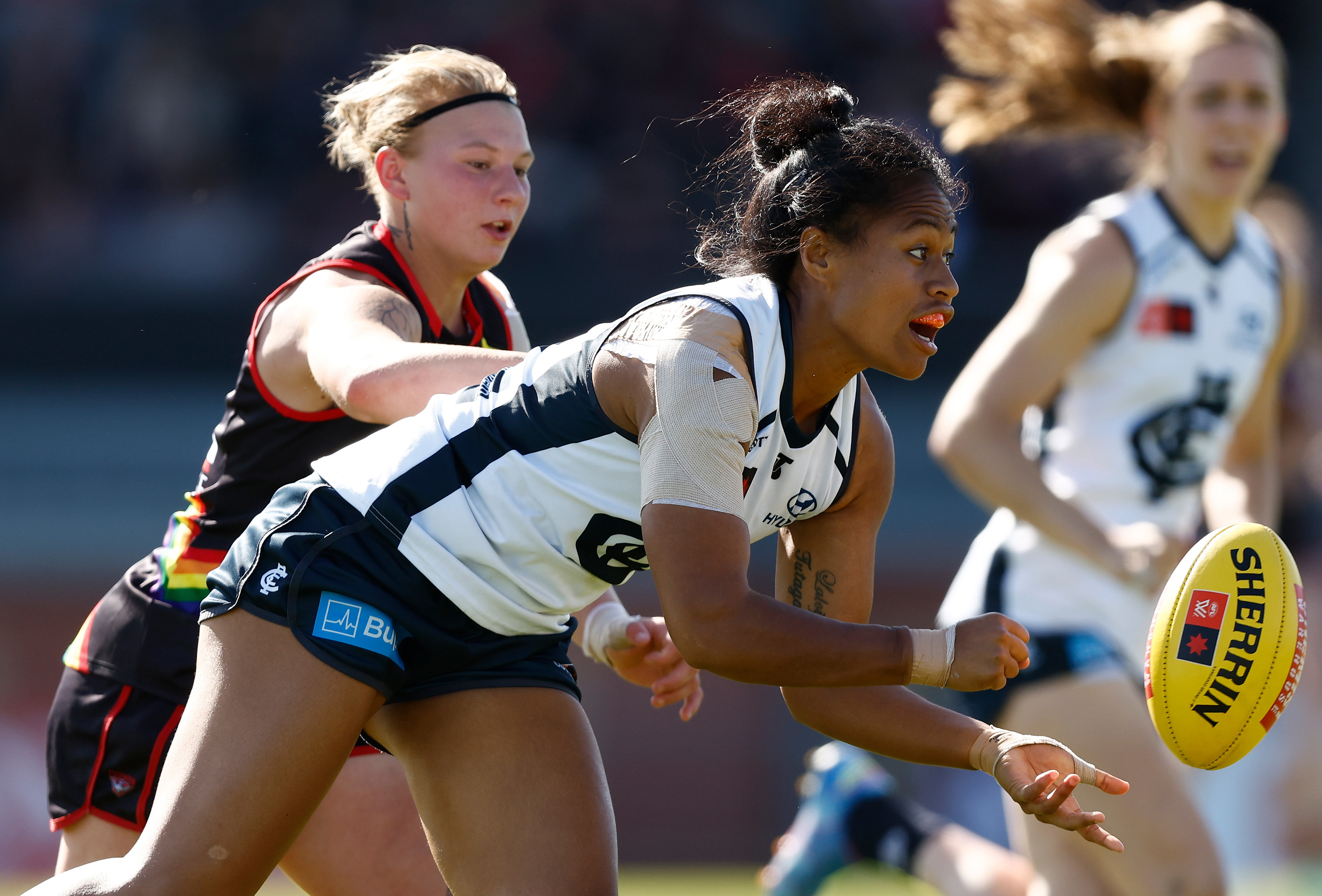 Vaomua Laloifi of the Blues is tackled by Paige Scott of the Bombers.