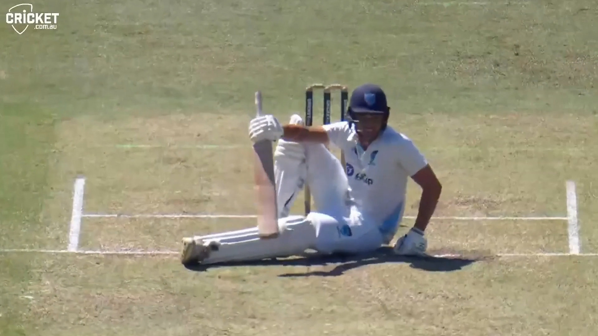 Chris Green sitting at the crease arguing.