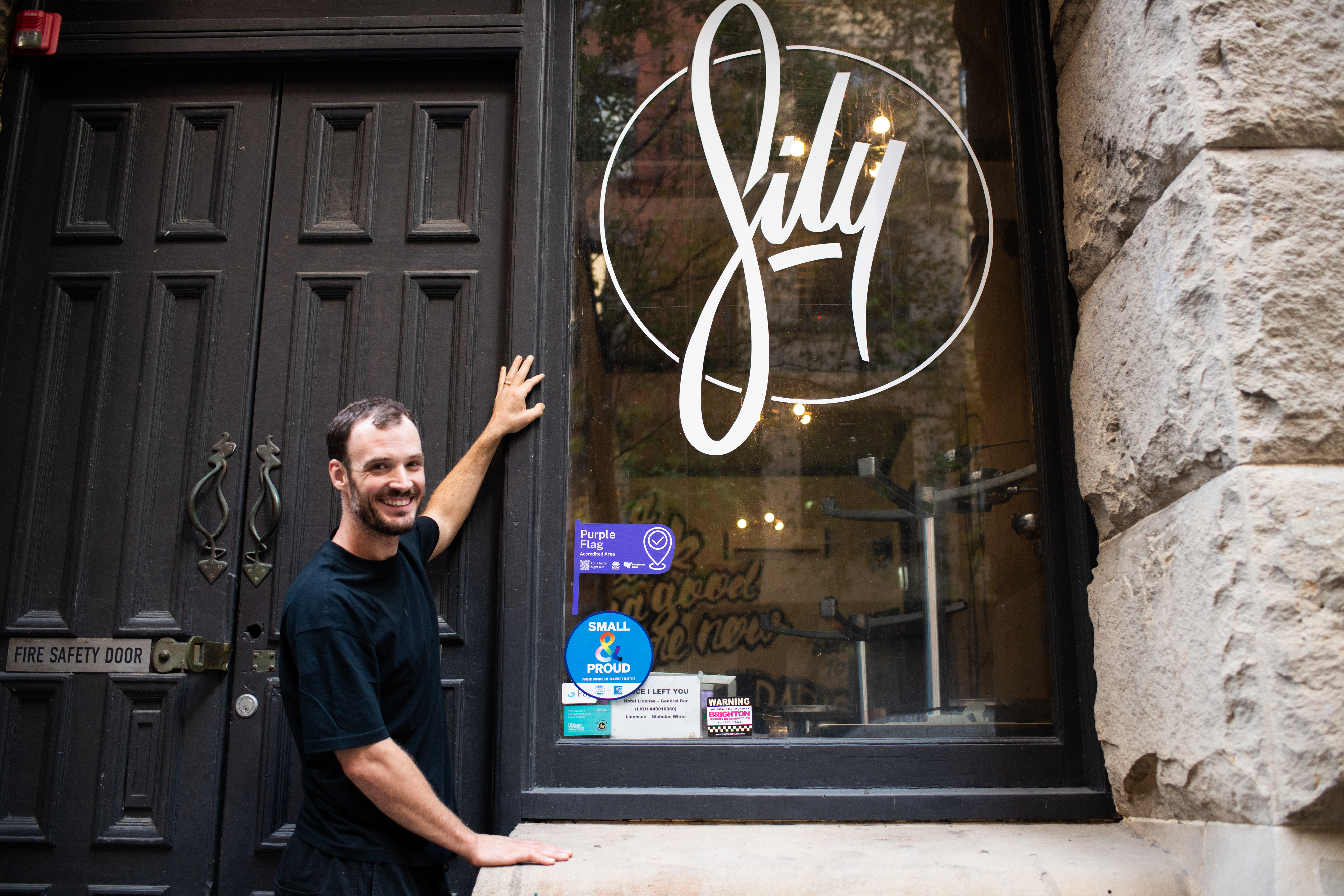 Nick White with his new purple flag sticker at SILY on Kent St in the Sydney CBD.