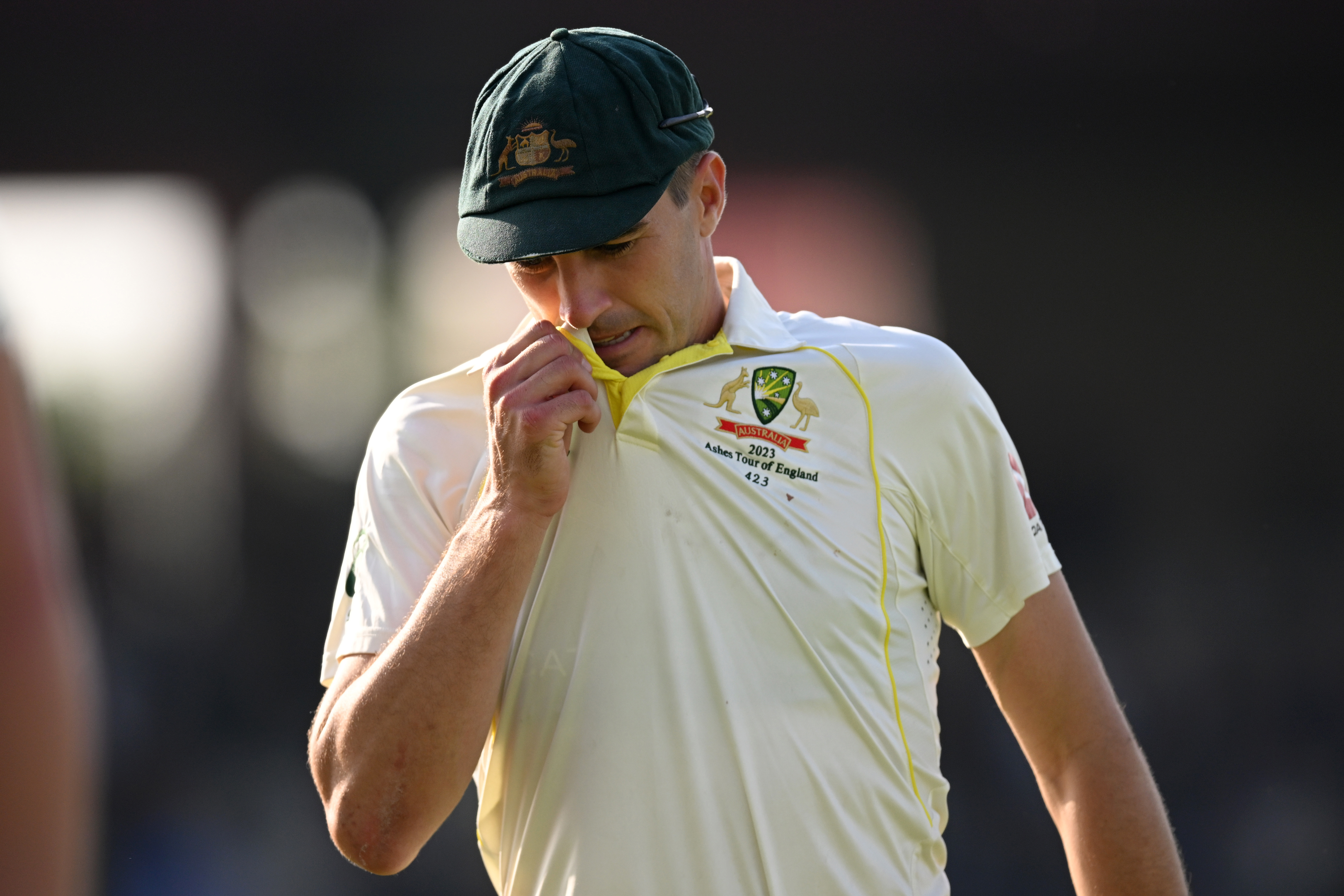 Australian captain Pat Cummins leaves the field at stumps on day two.