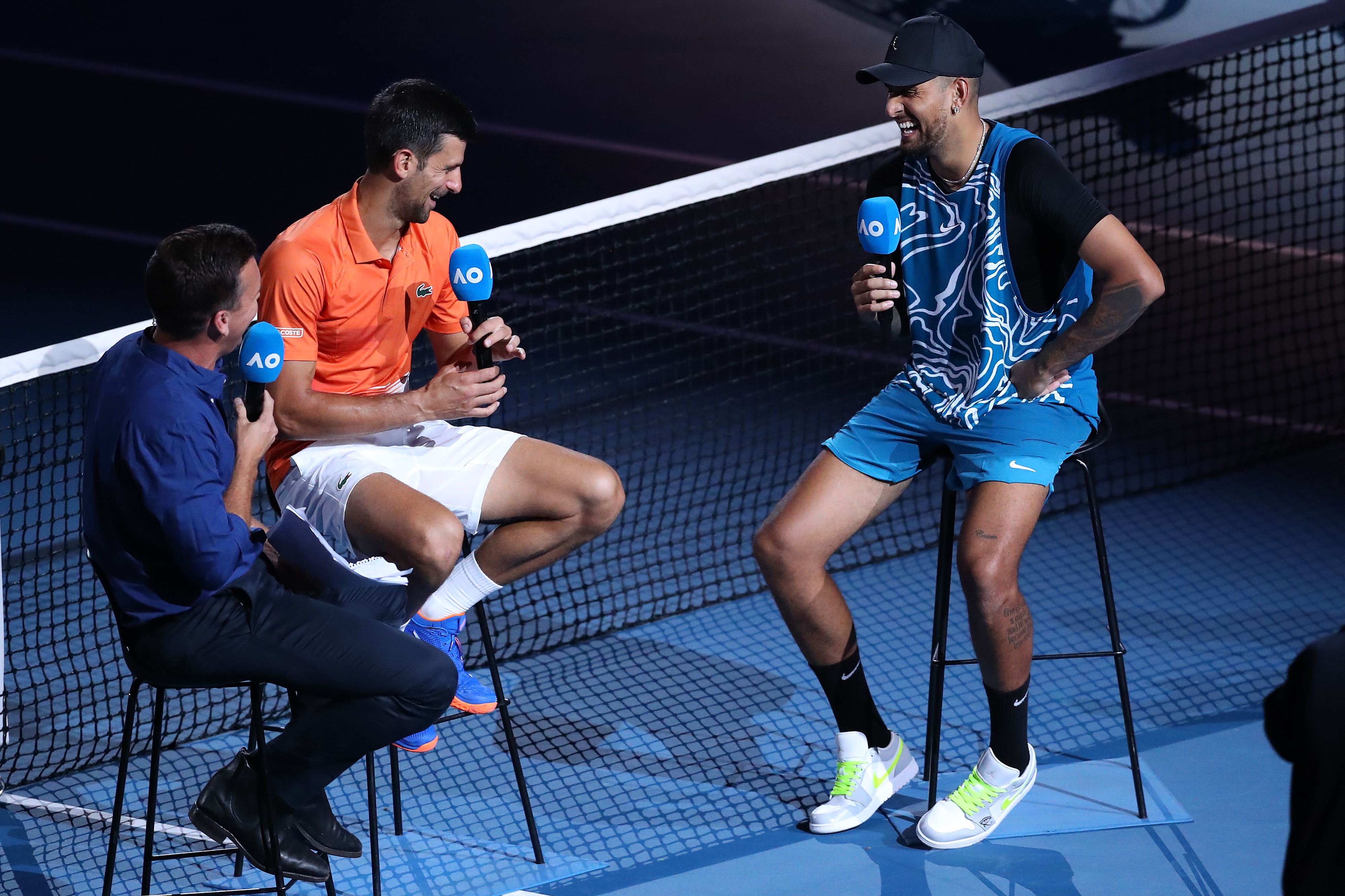 MELBOURNE, AUSTRALIA - JANUARY 13: Novak Djokovic of Serbia and Nick Kyrgios of Australia is interviewed by James Bracey after their Arena Showdown charity match aahead of the 2023 Australian Open at Melbourne Park on January 13, 2023 in Melbourne, Australia. (Photo by Kelly Defina/Getty Images)