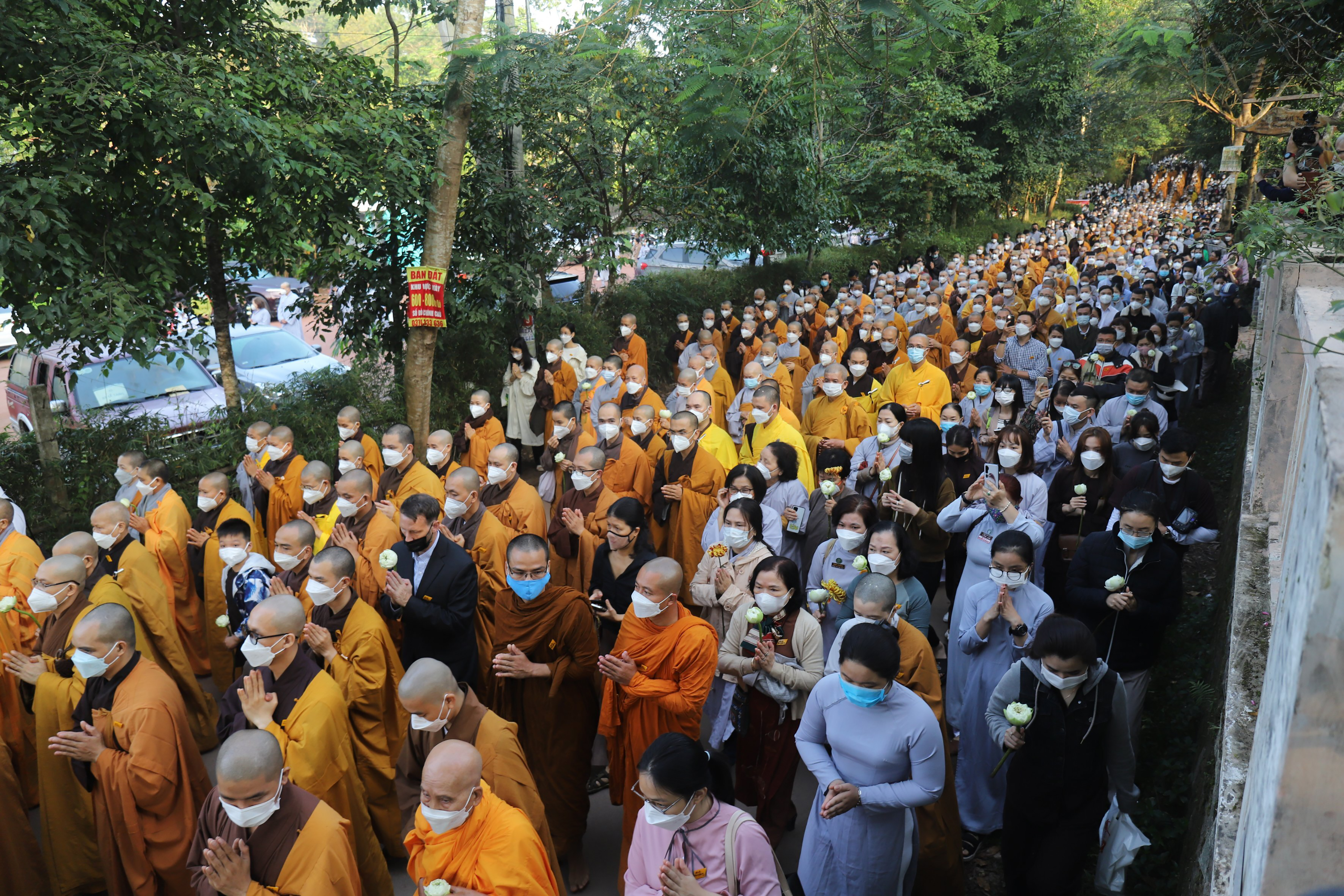 Monks and Thich Nhat Hanh followers trail behind the coffin of the renowned monk during his funeral in Hue, Vietnam on Saturday, Jan. 29, 2022. The Zen Master, who helped spread the practice of mindfulness in the West and socially engaged Buddhism in the East died on Jan. 22, 2022 at the age of 95. (AP Photo/Thanh Vo)