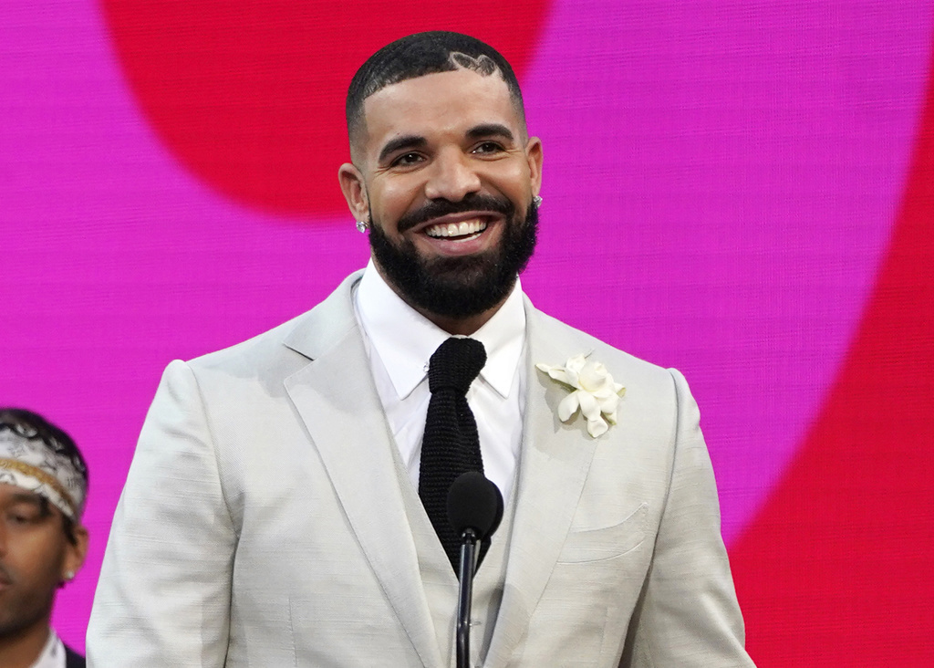 FILE - Drake appears at the Billboard Music Awards n Los Angeles on May 23, 2021. TikTok may look (or sound) a little different when you scroll through the app going forward. Earlier this week, Universal Music Group which represents big-name artists like Taylor Swift, Bad Bunny and Drake said that it would no longer allow its music on TikTok following the expiration of a licensing deal between the two companies, Wednesday, Jan. 31, 2024. Now, the takedown of UMG-related music has begun, ByteDa