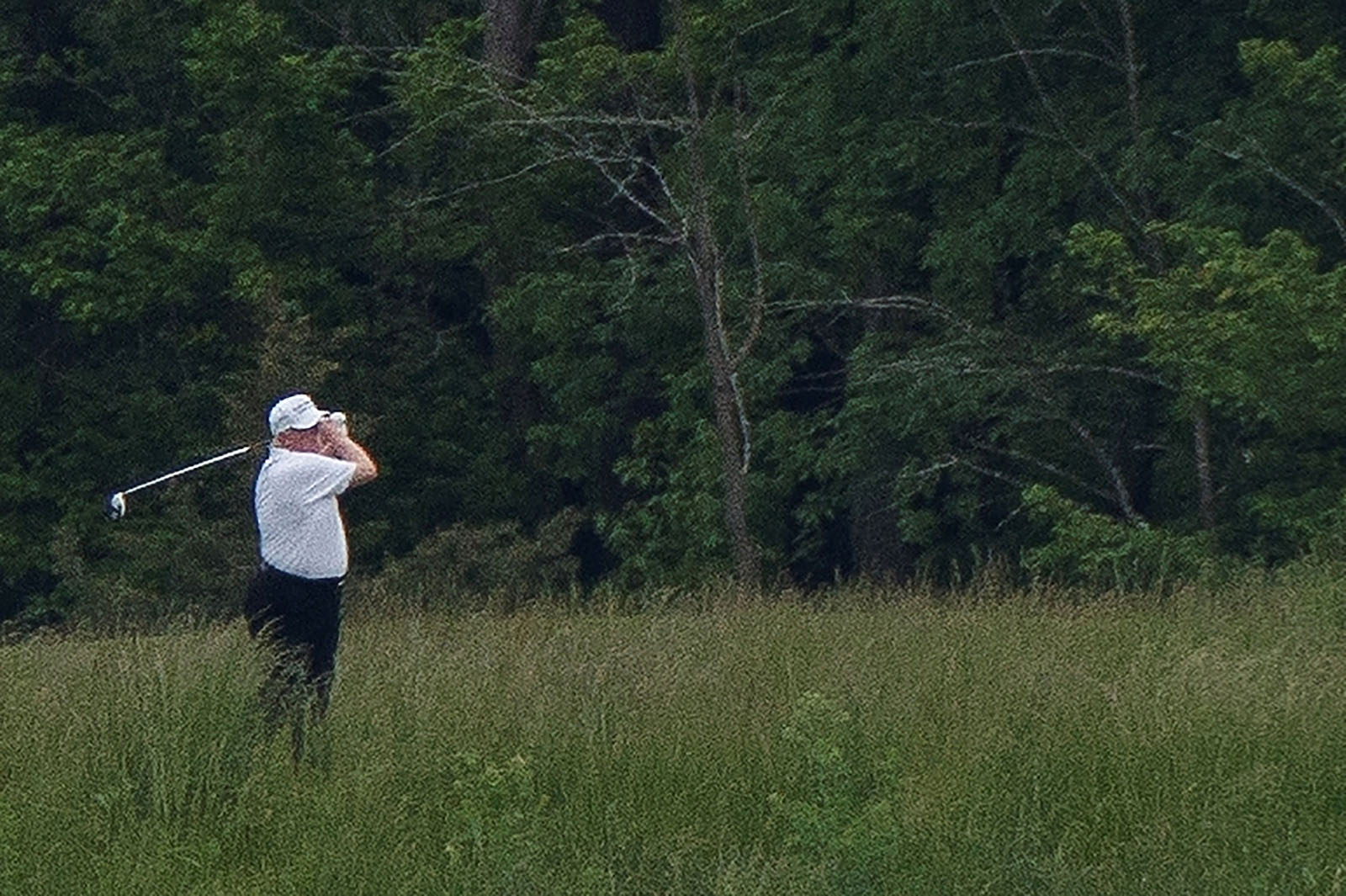 US. President Donald Trump swings a golf club during a round of golf, amid the COVID-19 outbreak, in Sterling, Virginia, U.S., May 24, 2020. Photo by Tom Brenner