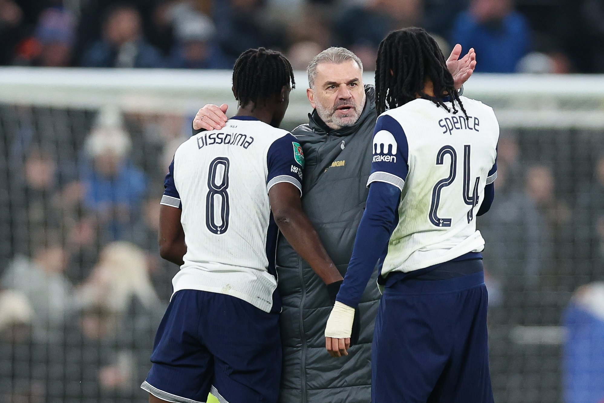 Tottenham manager Ange Postecoglou celebrates with Yves Bissouma and Djed Spence after the Carabao Cup semi final first leg match against Liverpool at Tottenham Hotspur Stadium on January 08, 2025 in London, England. (Photo by Harry Murphy - Danehouse/Getty Images)