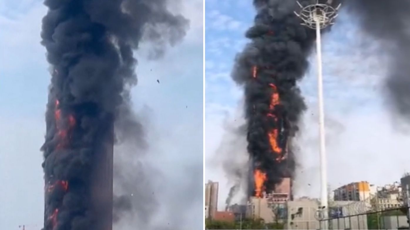 Images taken from videos posted to social media show plumes of black smoke billow from a building in China.