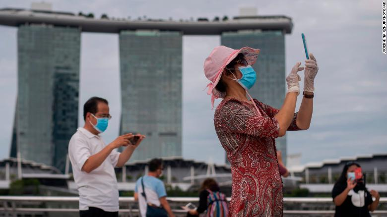 People were still wearing masks and gloves while visiting Singapore's Marina Bay. 