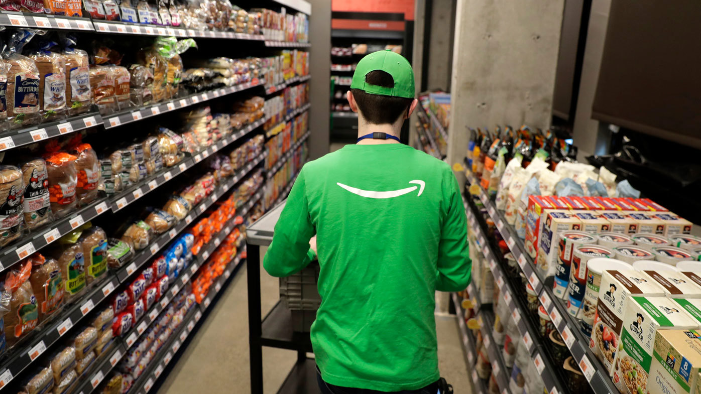 An employee at an Amazon Go grocery store.