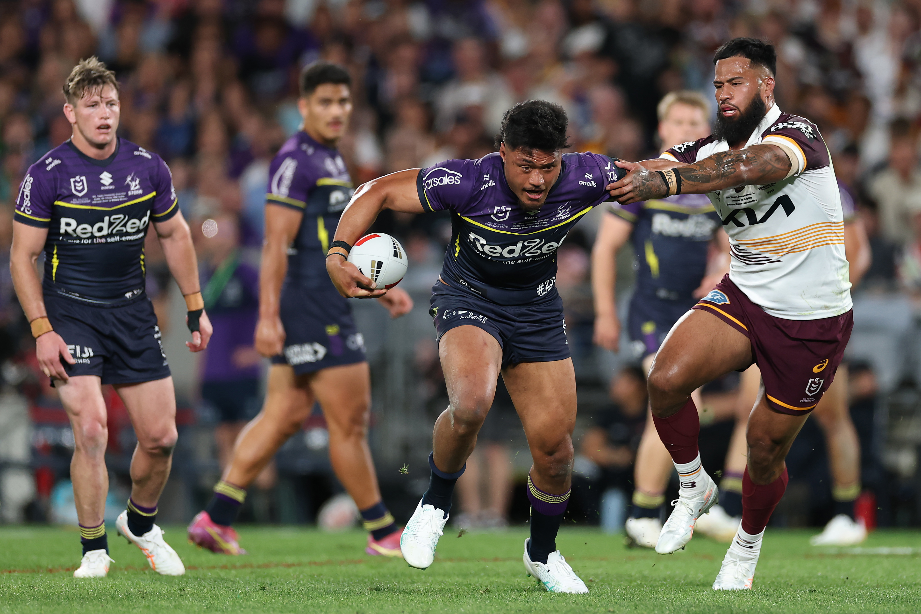 Stefano Utoikamanu is tackled by Payne Haas during the 2025 NRL grand final.