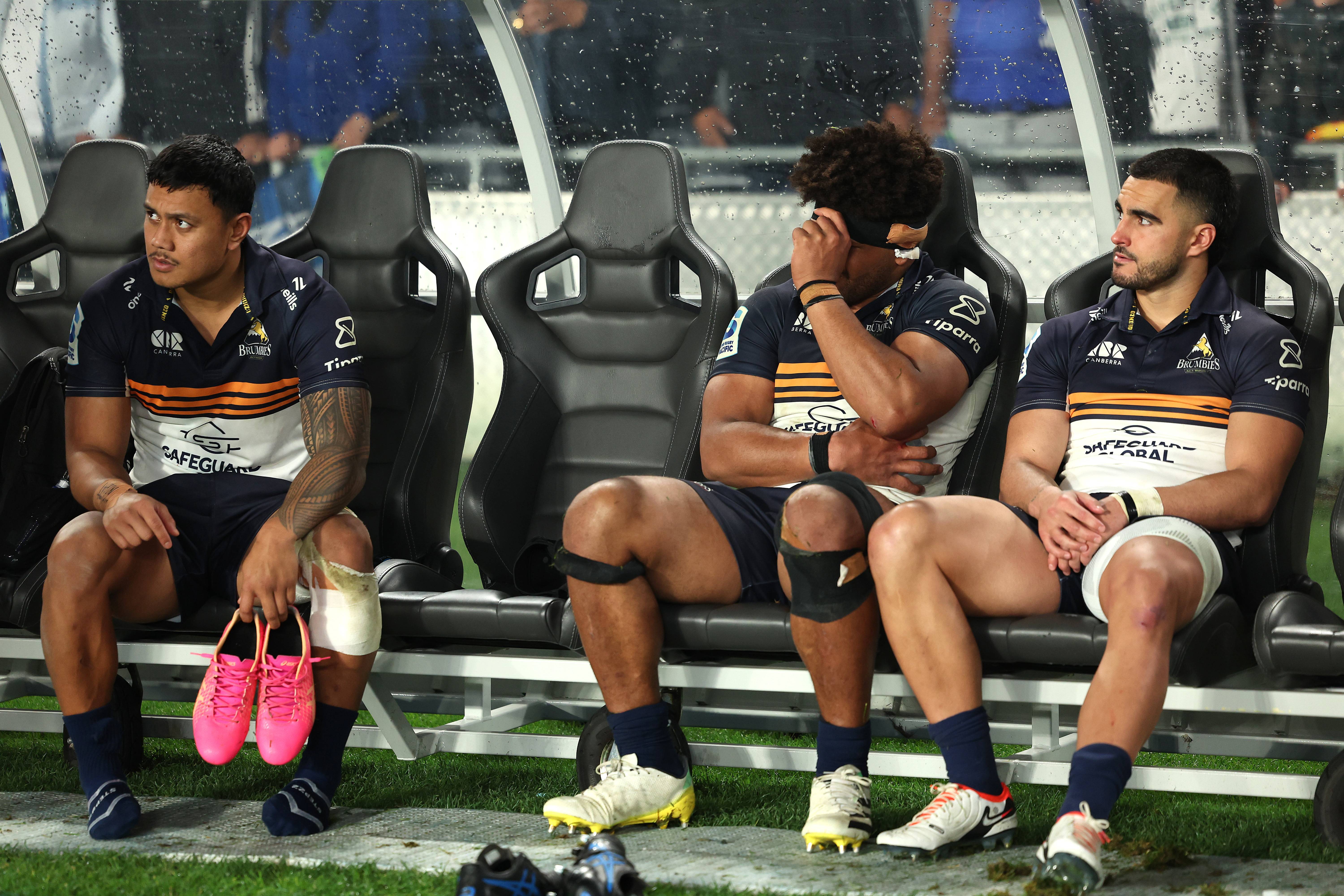 Len Ikitau, Rob Valetini and Tom Wright of the Brumbies following the match.