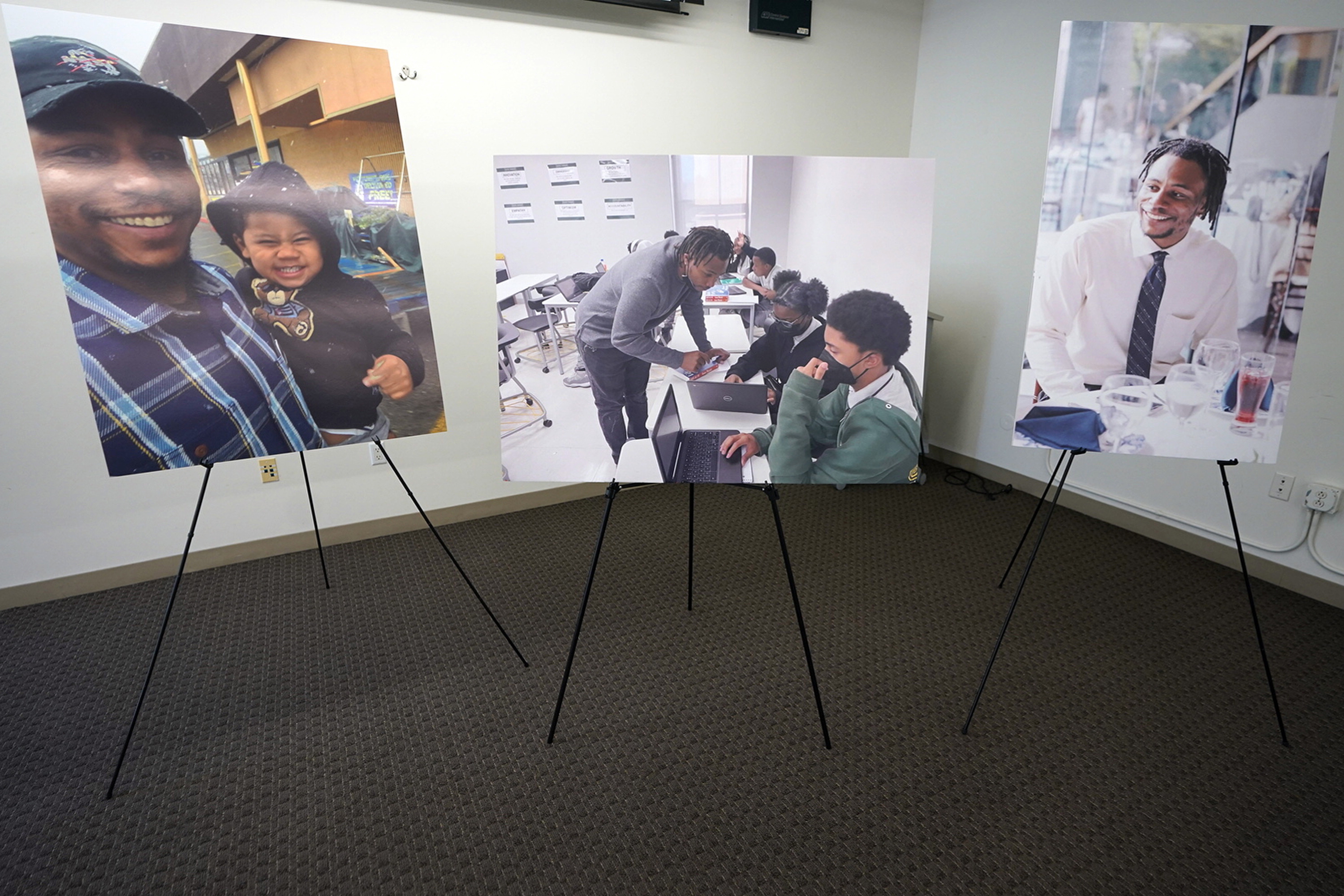 Pictures of 31-year-old teacher, Keenan Anderson, who was tasered multiple times during a struggle with LAPD officers in Venice and died at a hospital, are displayed at news conference.