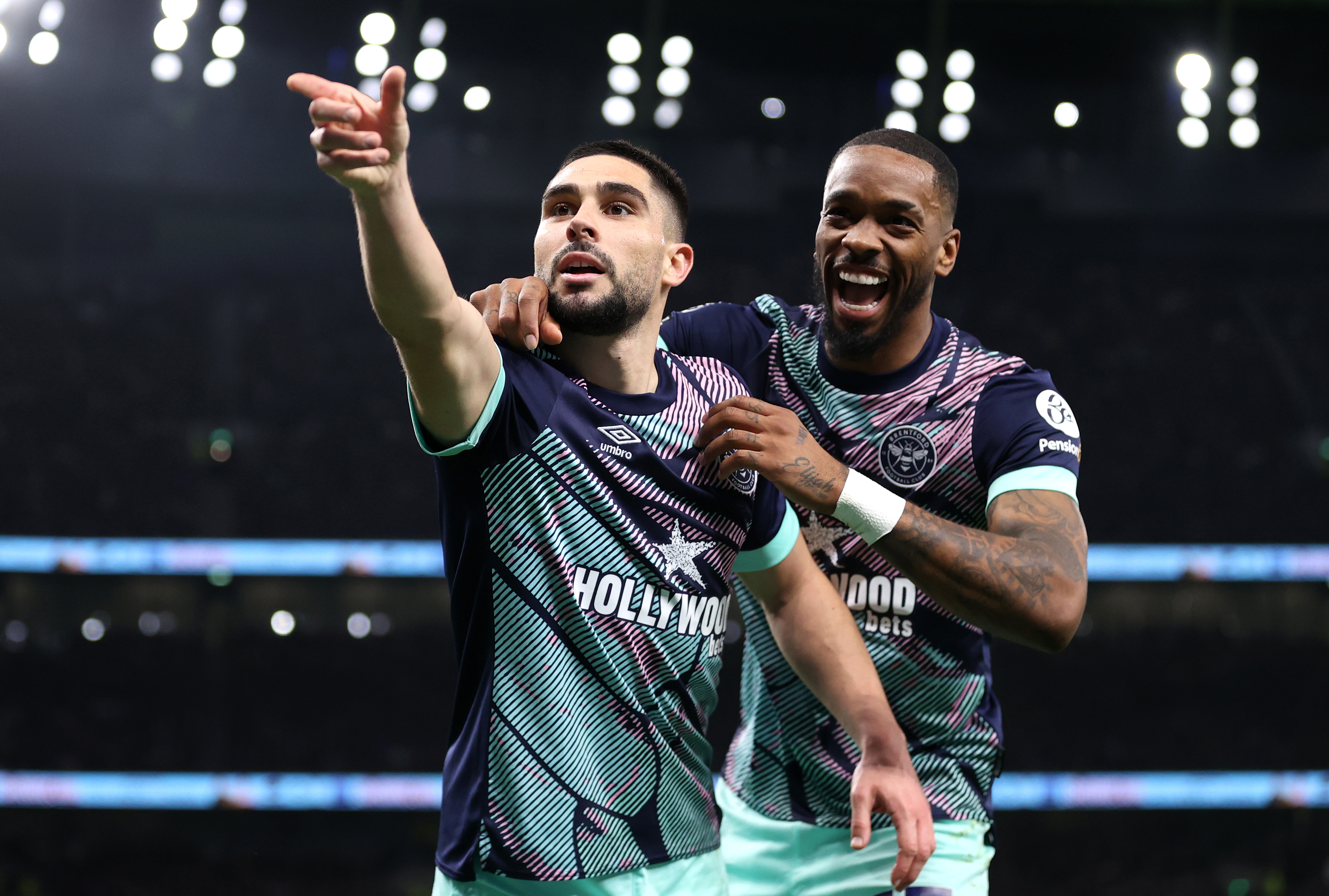Neal Maupay of Brentford celebrates scoring his team's first goal with team mate Ivan Toney during the Premier League match between Tottenham Hotspur and Brentford FC.
