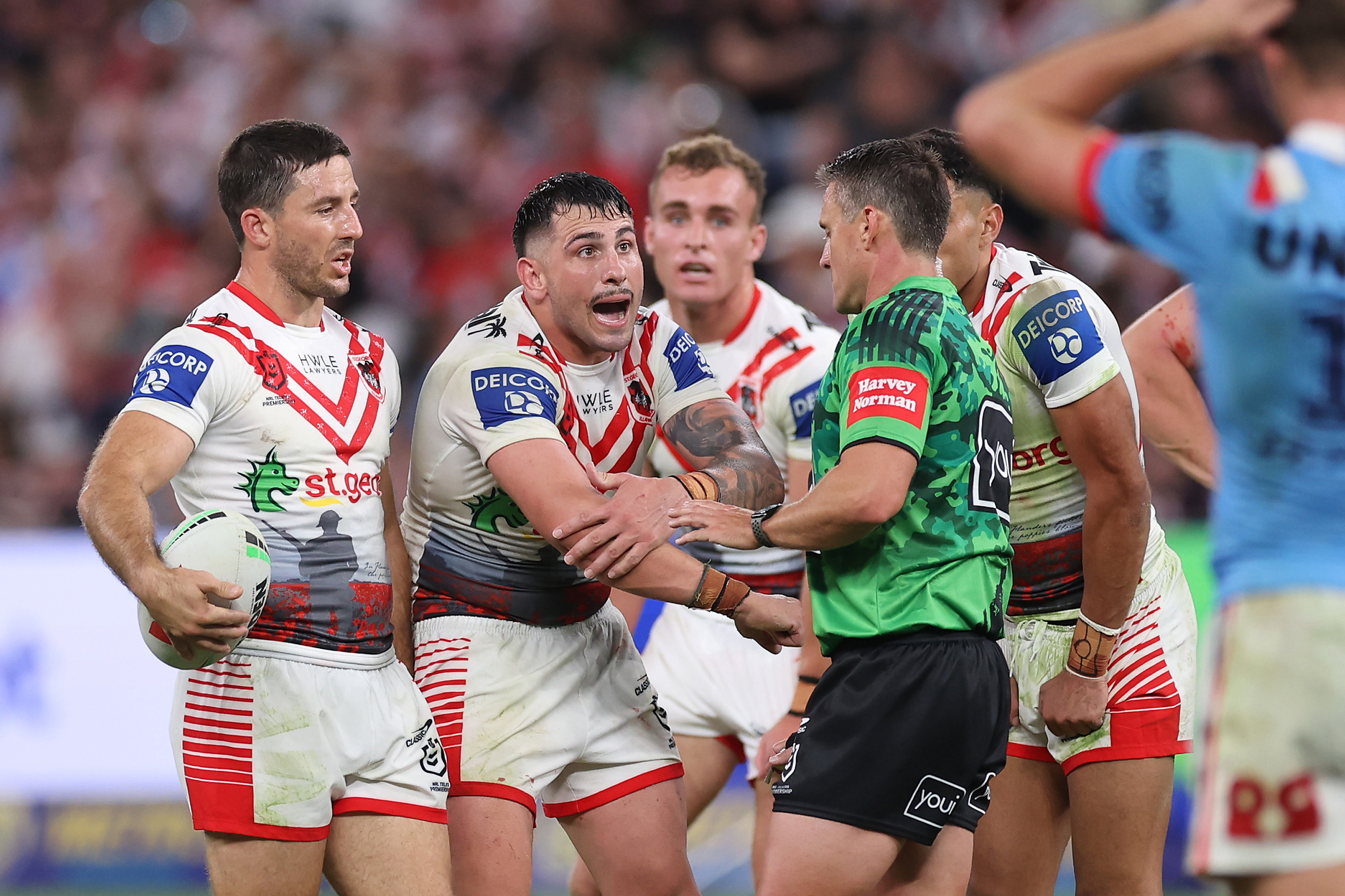 Jack Bird of the Dragons talks to referee Adam Gee.