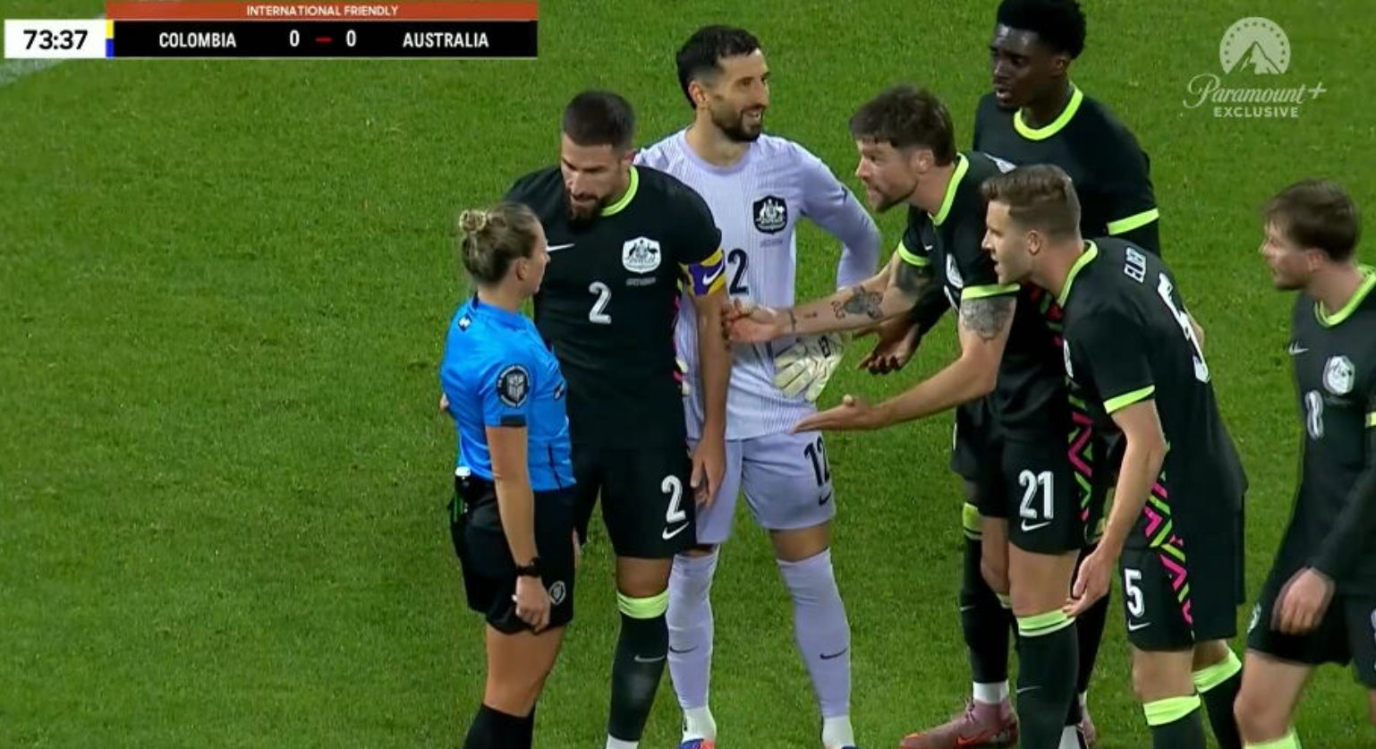 The Socceroos complain about the penalty decision.