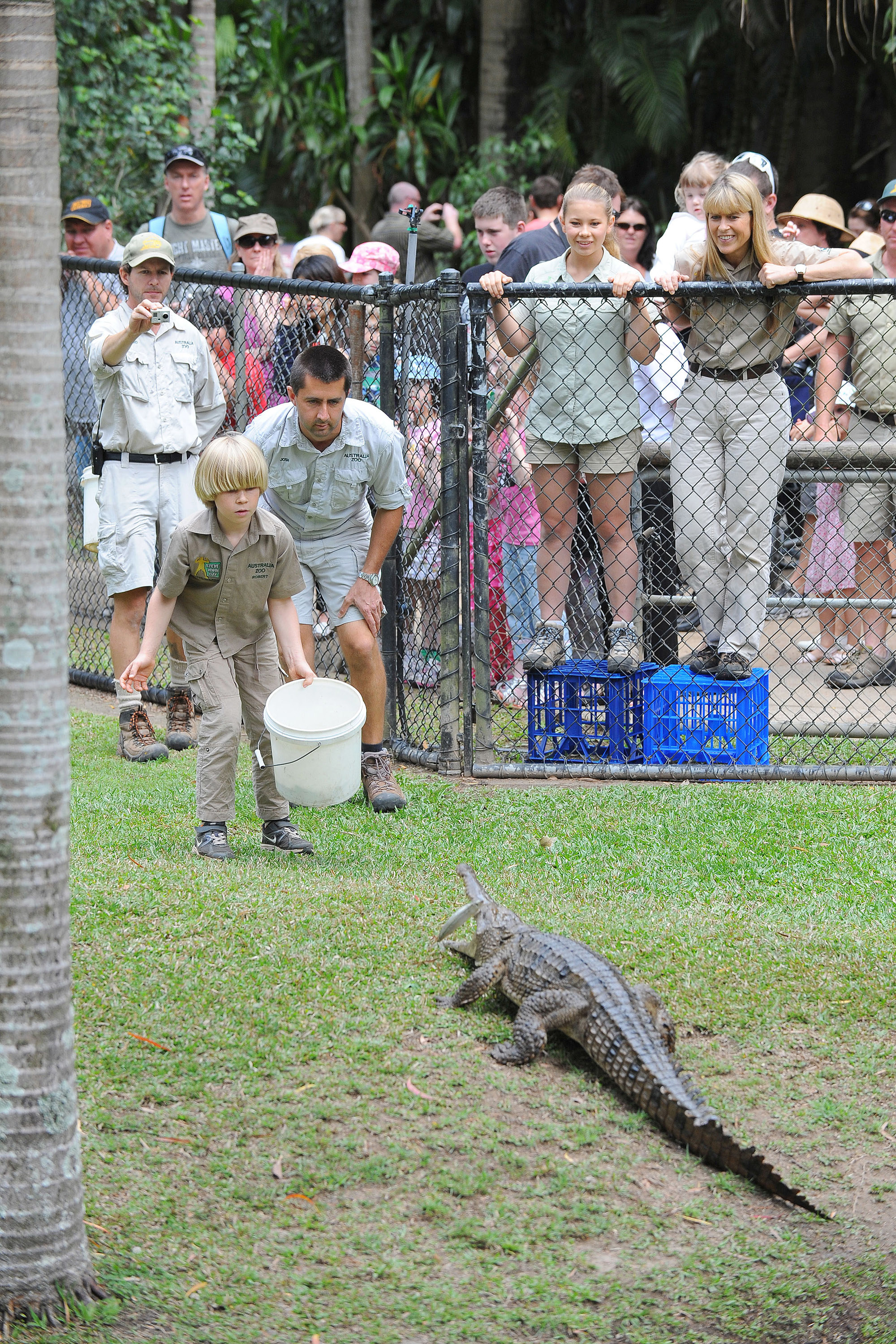 SUNSHINE COAST, AUSTRALIA - OCTOBER 2: In this handout photo provided by Australia Zoo, Robert Irwin feeds a freshwater crocodiles with Australia Zoo's Head of Reptiles, Josh Ruffell at Australia Zoo on October 2, 2012 on the Sunshine Coast, Australia. Robert Irwin, 8, feed freshwater crocodiles for the first time publicly today. (Photo by Ben Beaden/Australia Zoo via Getty Images)