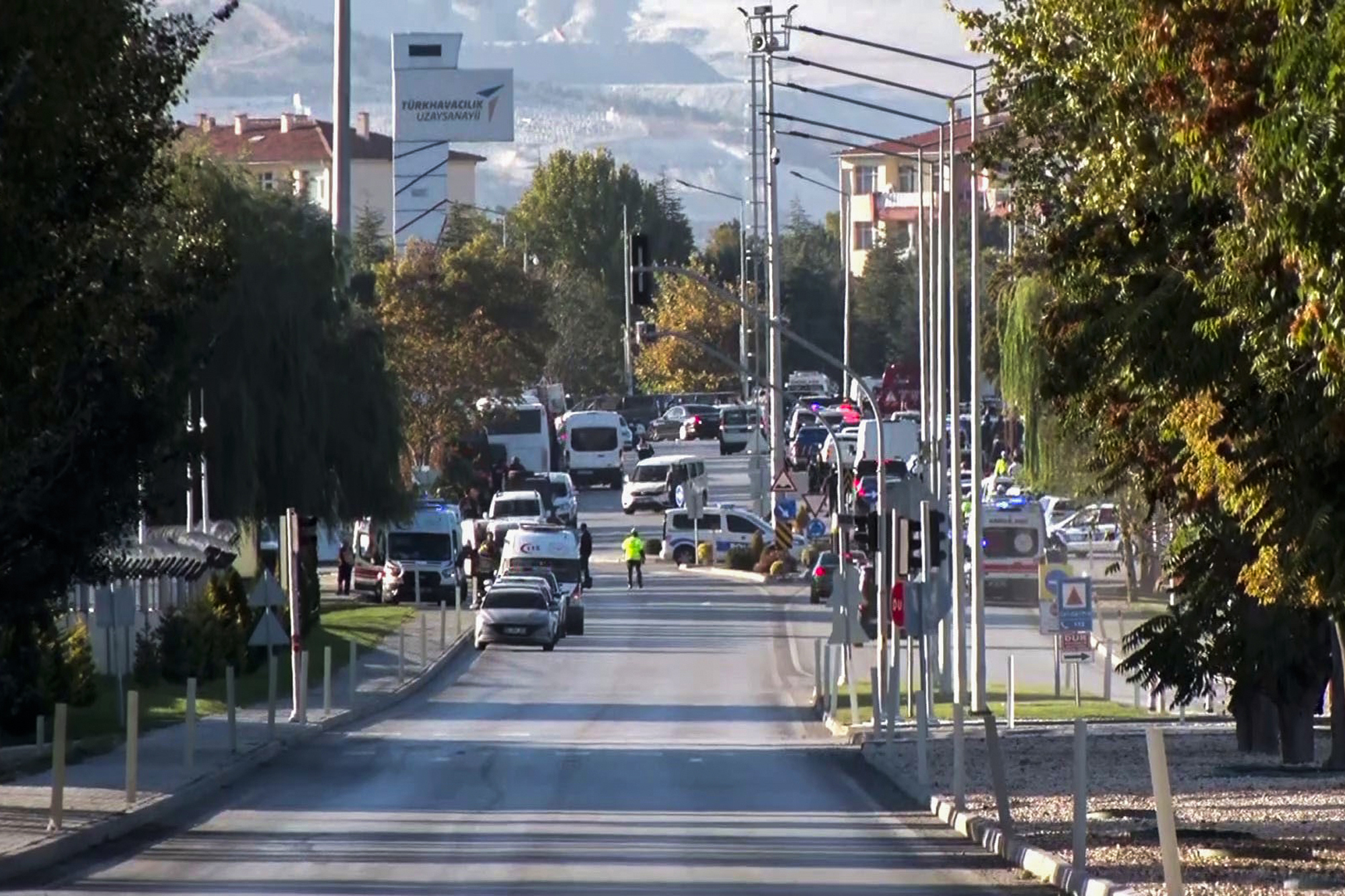 Emergency rescue teams and police officers work outside of Turkish Aerospace Industries Inc. on the outskirts of Ankara, Turkey, Wednesday, Oct. 23, 2024. 