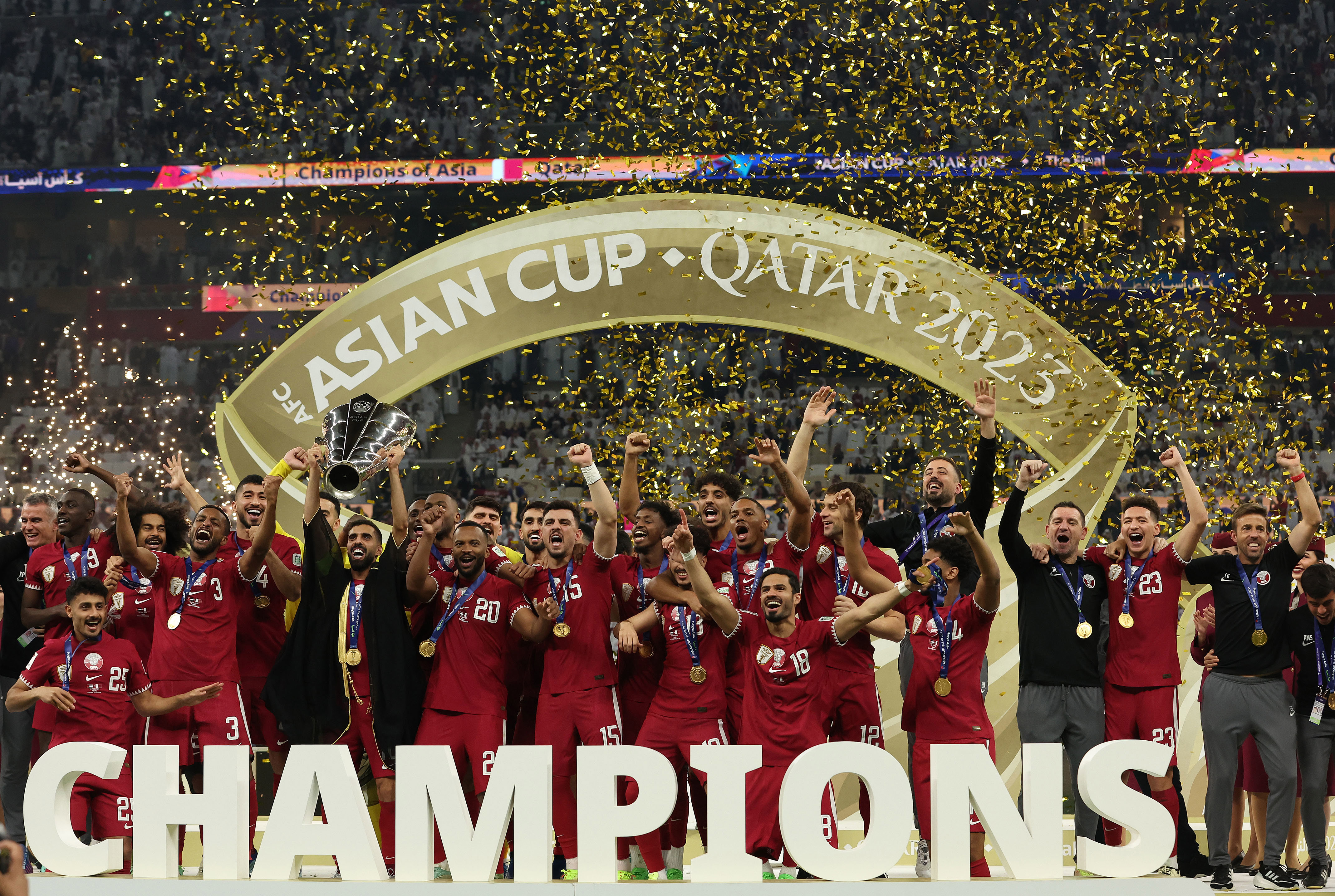 Hassan Al Haydos of Qatar lifts the AFC Asian Cup trophy after their team's victory in the AFC Asian Cup final match between Jordan and Qatar at Lusail Stadium on February 10, 2024 in Lusail City, Qatar. (Photo by Robert Cianflone/Getty Images)