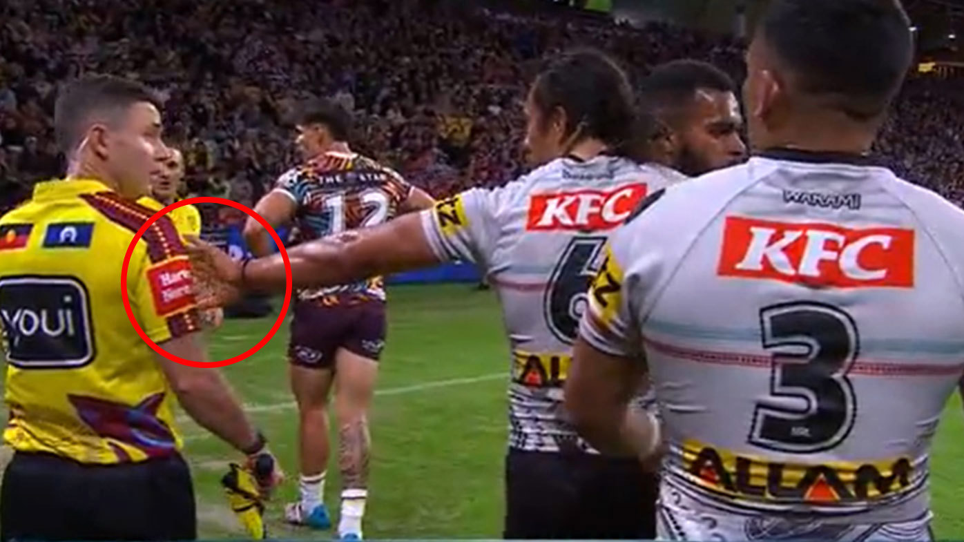 The touchline referee looked unimpressed as Jarome Luai touched him with his left hand after the Panthers' opener