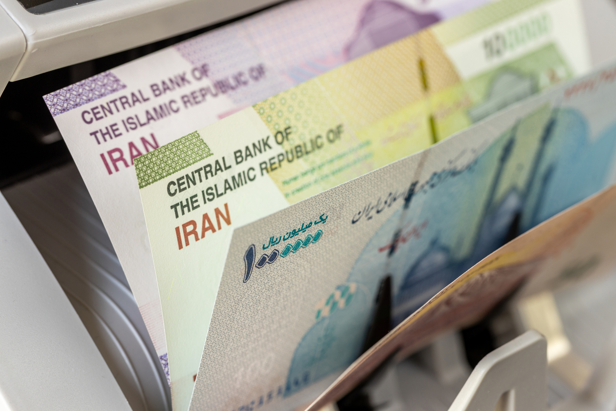 Iran, rial banknotes. Money counting machine with Iranian currency. Financial concept. close up