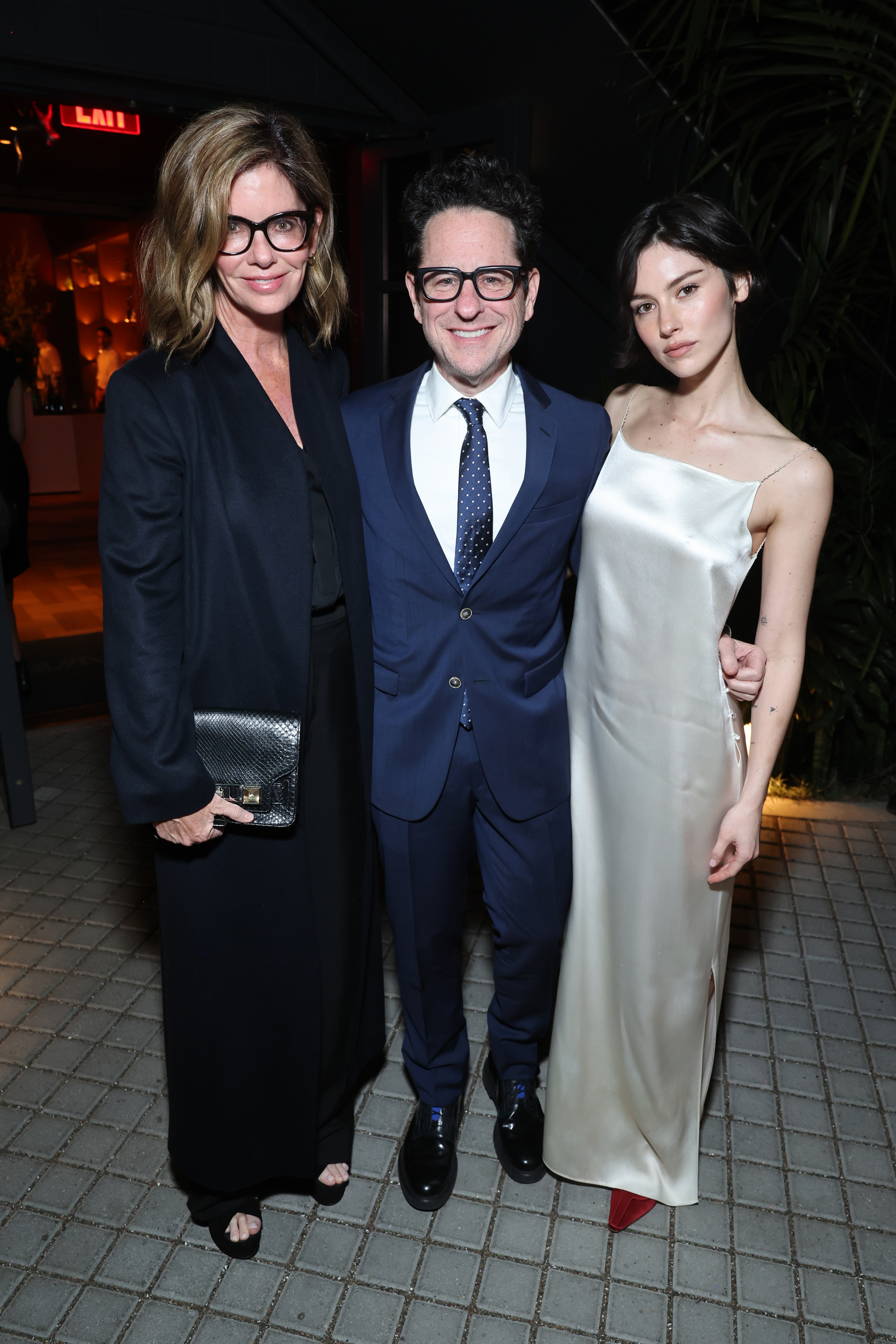  (L-R) Katie McGrath, J.J. Abrams and Gracie Abrams attend the CAA pre-Oscar party at Living Room on March 13, 2026 in Los Angeles, California.  (Photo by Randy Shropshire/Getty Images for Creative Artists Agency, LLC)
