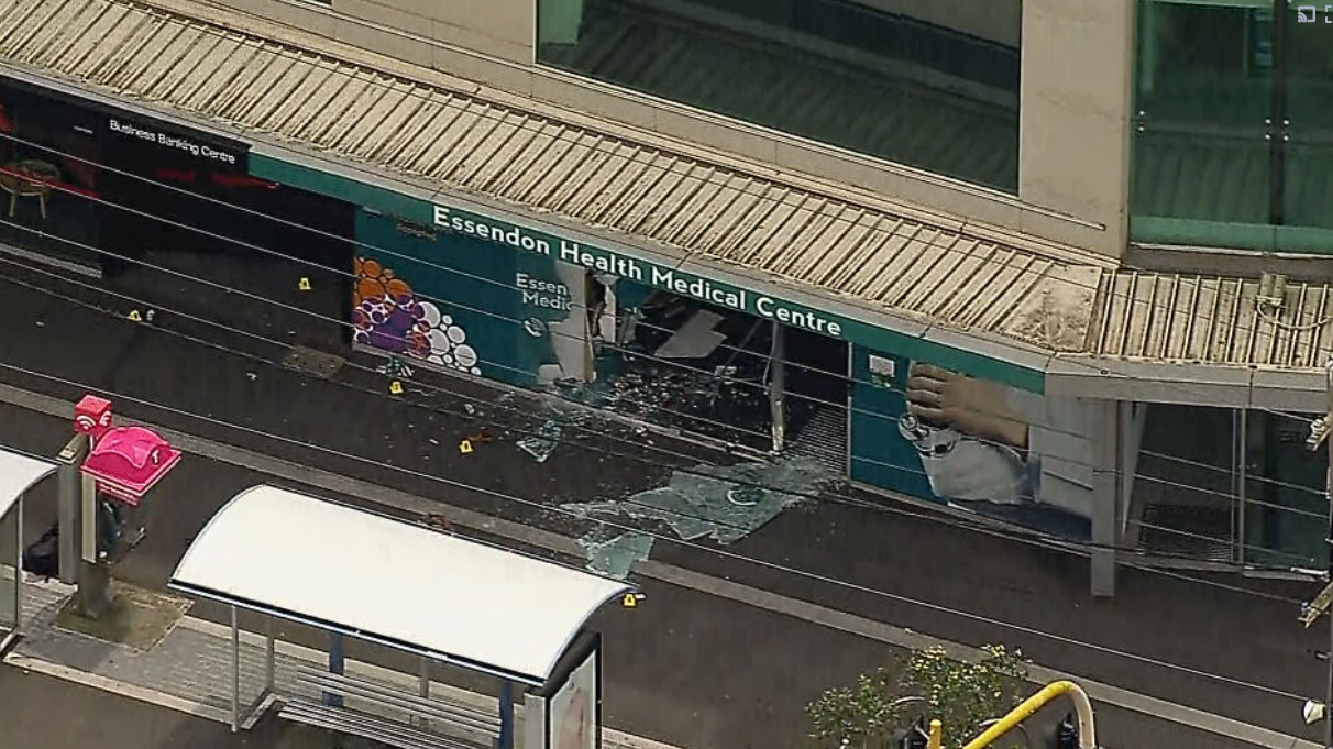 Man killed, woman injured after car veers over footpath and through medical centre 