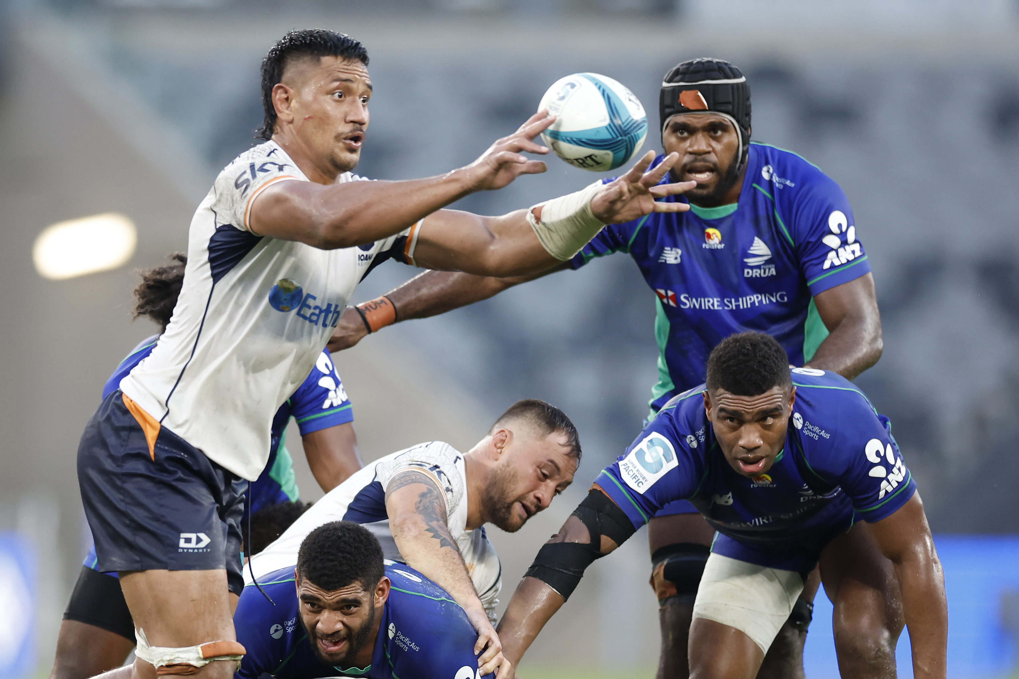 Michael Curry of Moana Pasifika passes the ball.