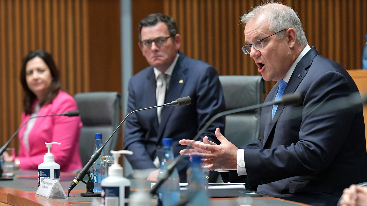 Australian Prime Minister Scott Morrison speaks with state premiers Annastacia Palaszczuk and Daniel Andrews at a National Cabinet meeting.