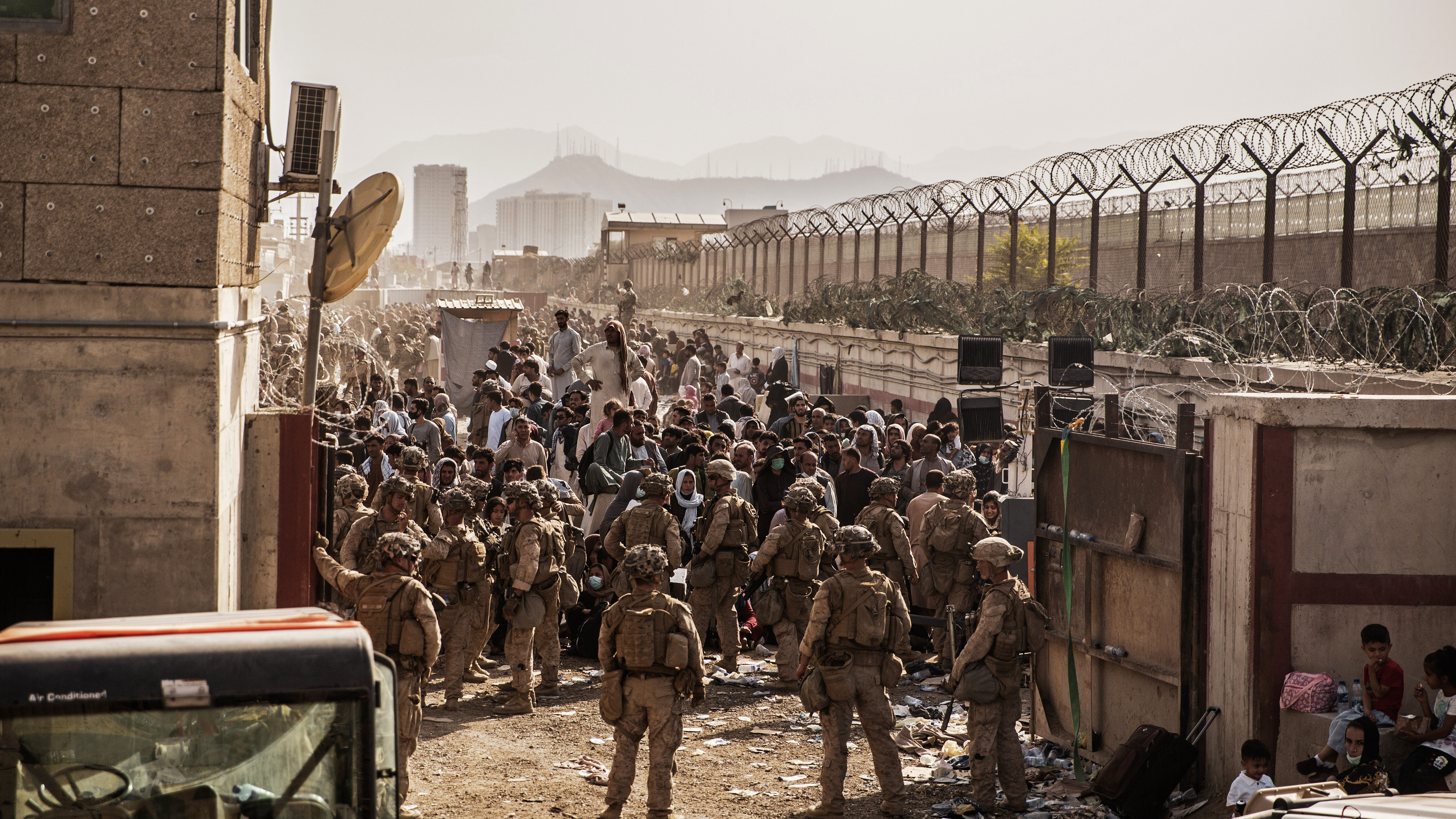US Marines with Special Purpose Marine Air-Ground Task Force - Crisis Response - Central Command, provide assistance during an evacuation at Hamid Karzai International Airport, Kabul, Afghanistan earlier this week.