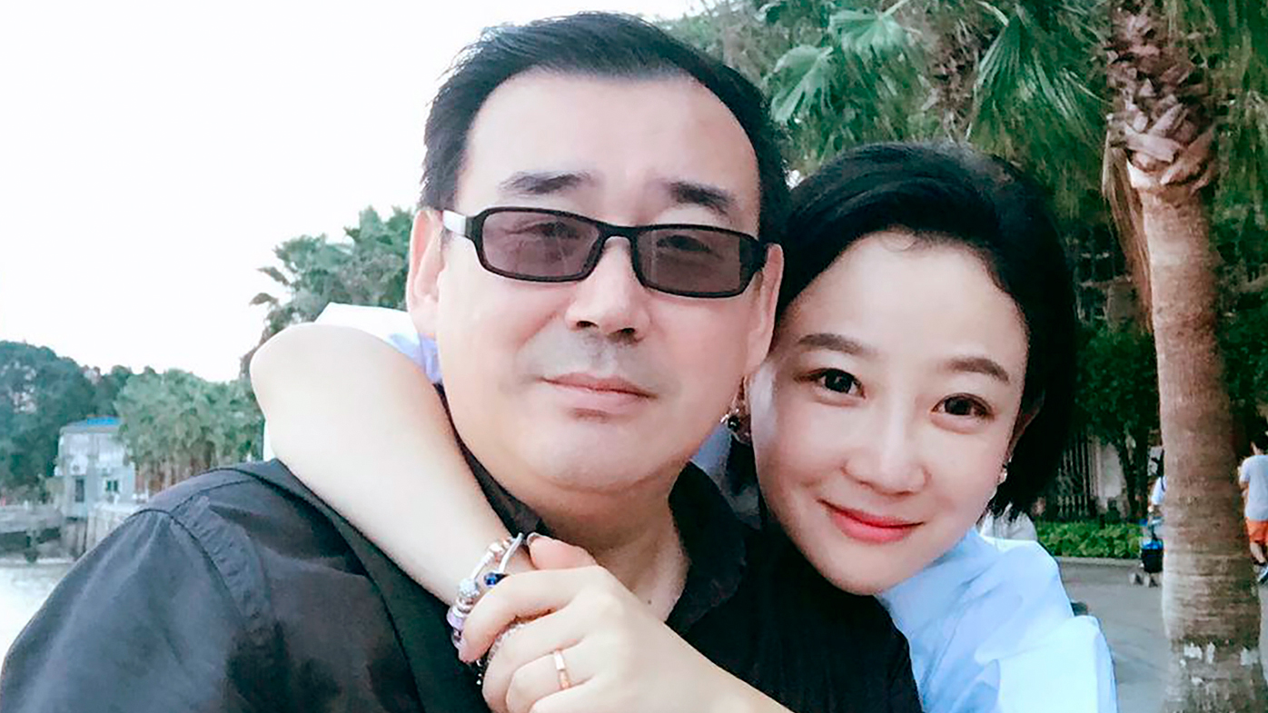 Yang Hengjun, left, poses with a family member in Beijing. Australia's Foreign Minister Marise Payne said her government was "deeply disappointed" that the Chinese-Australian writer was placed in criminal detention in Beijing six months after he was taken into custody at a Chinese airport.